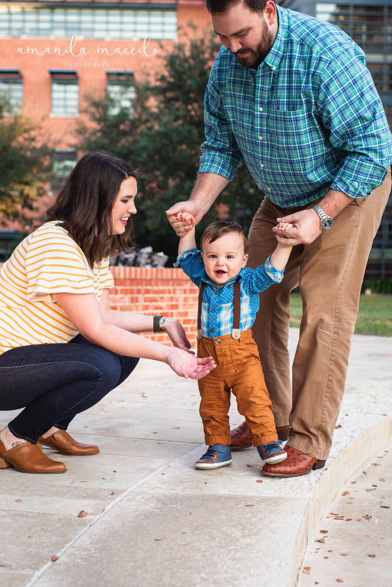 Family Photographer, parents helping baby walk