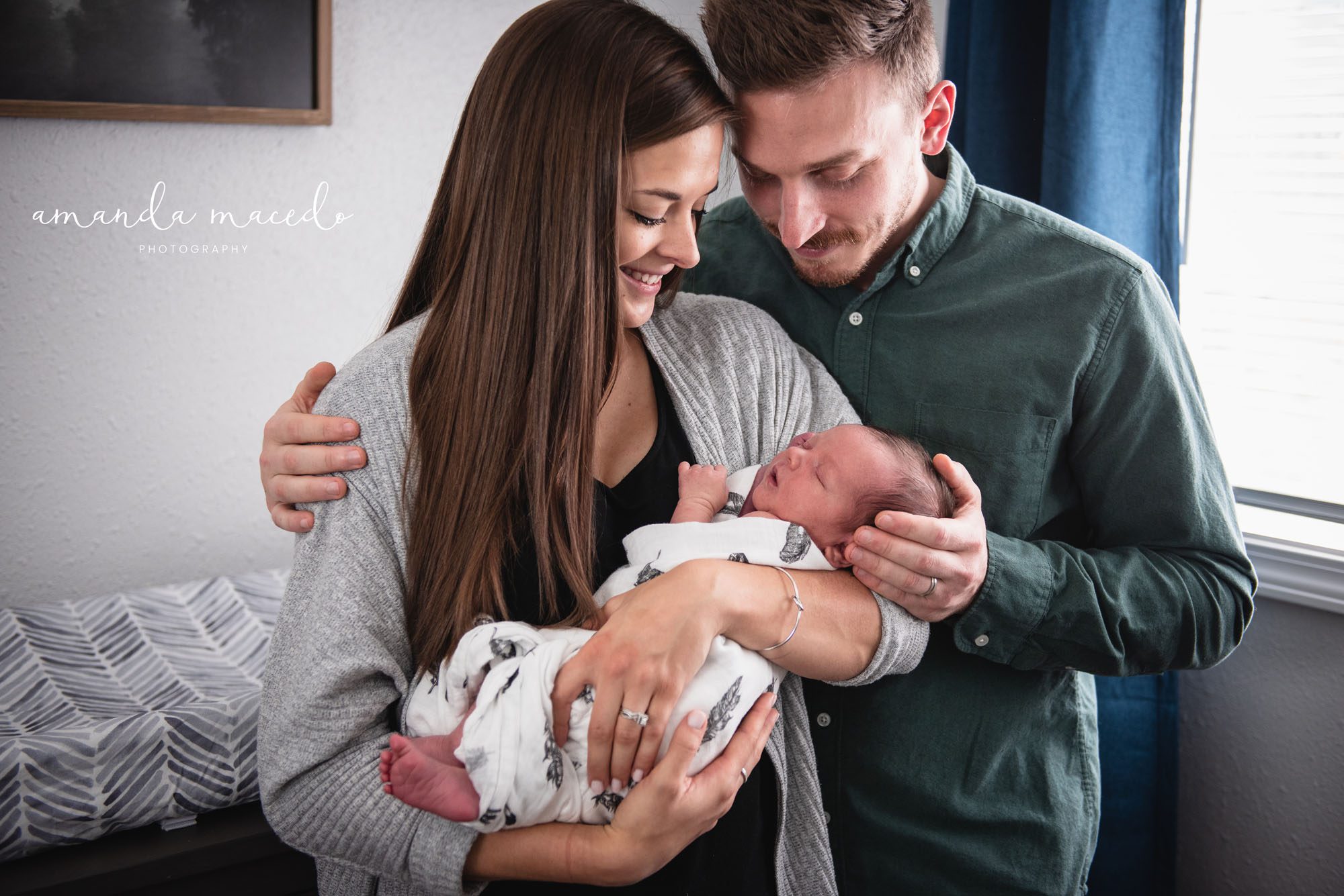 Newborn photographer, mother holding newborn baby