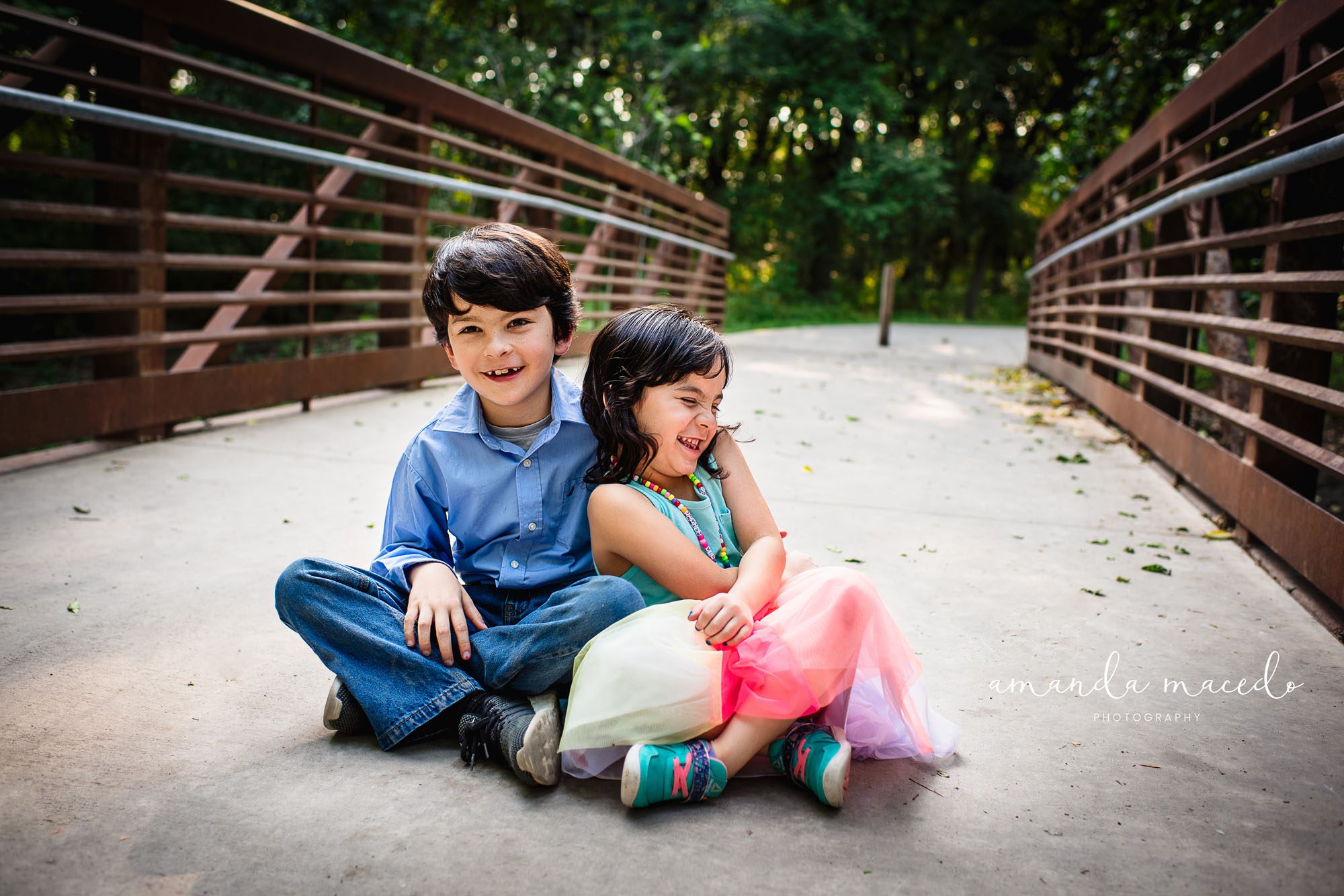 Child photographer, brother and sister laughing