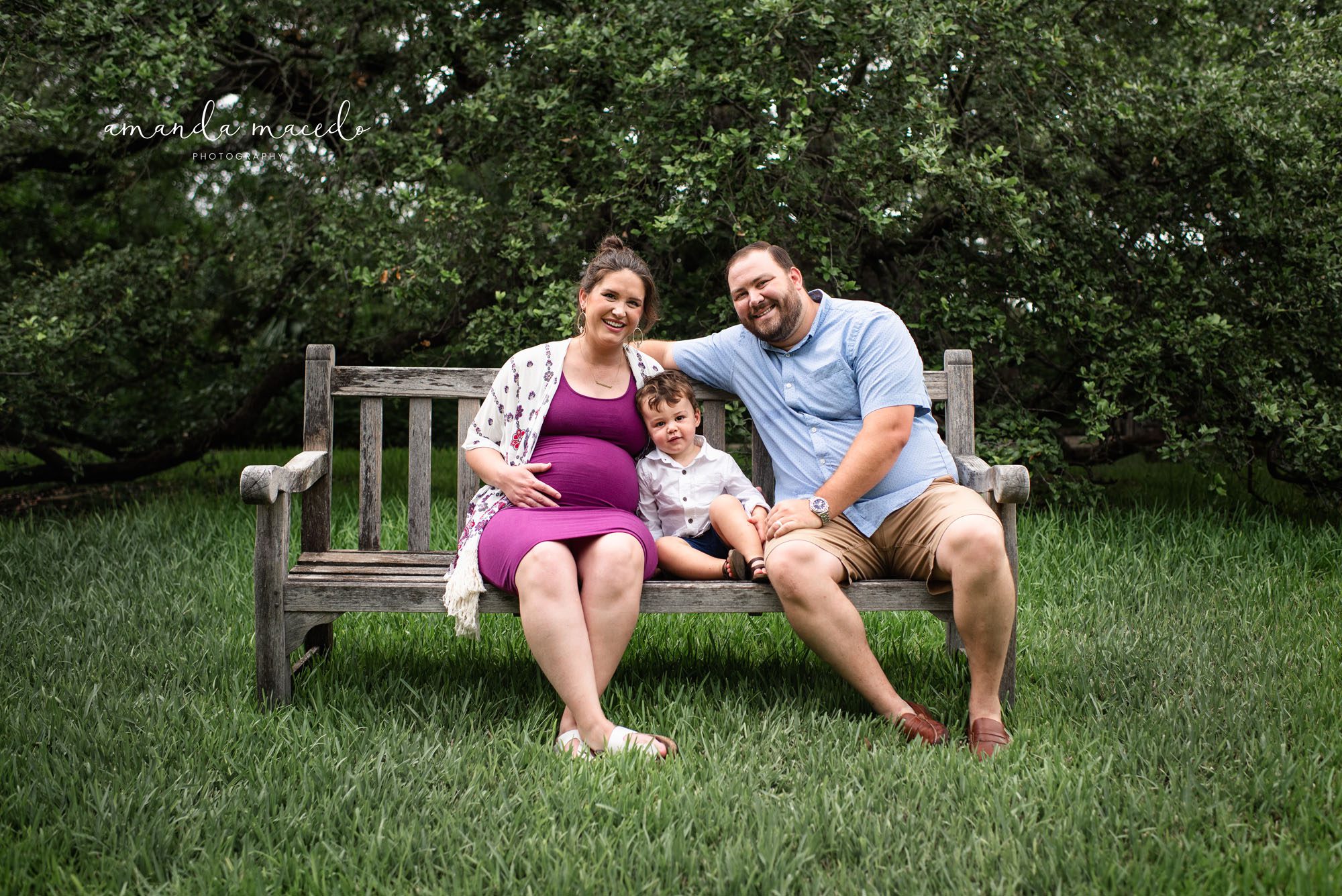 Maternity photographer, family sitting on bench together