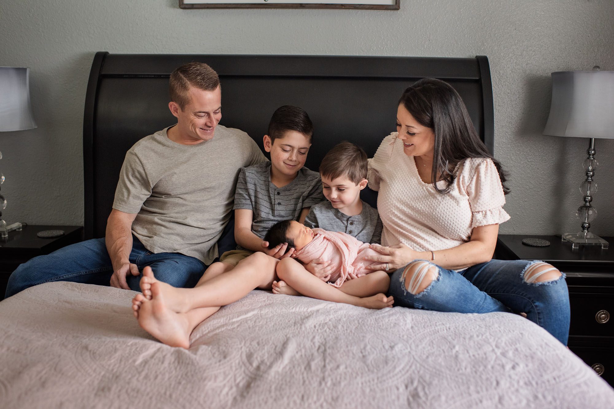Family holding newborn sister, San Antonio Newborn Photographer