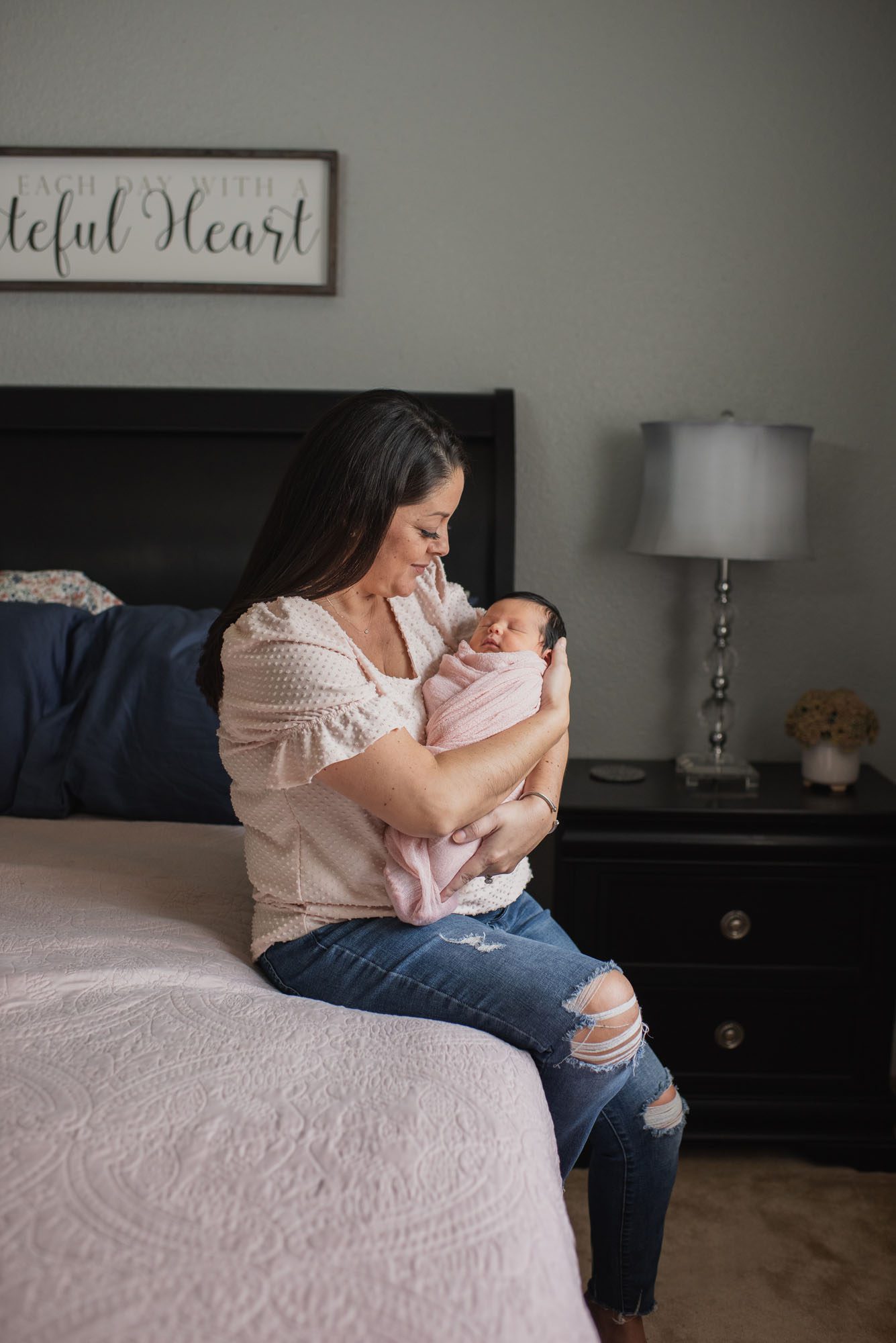 Mother with baby girl on bed, Lifestyle Newborn Photography San Antonio