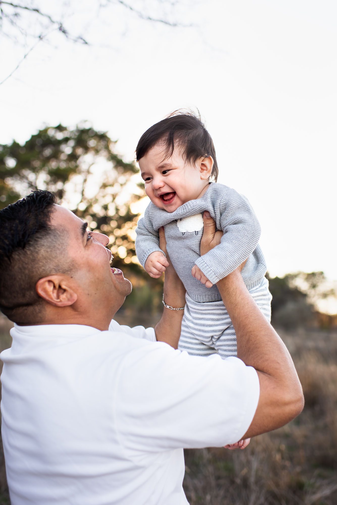 Dad holding up baby, San Antonio lifestyle photographer