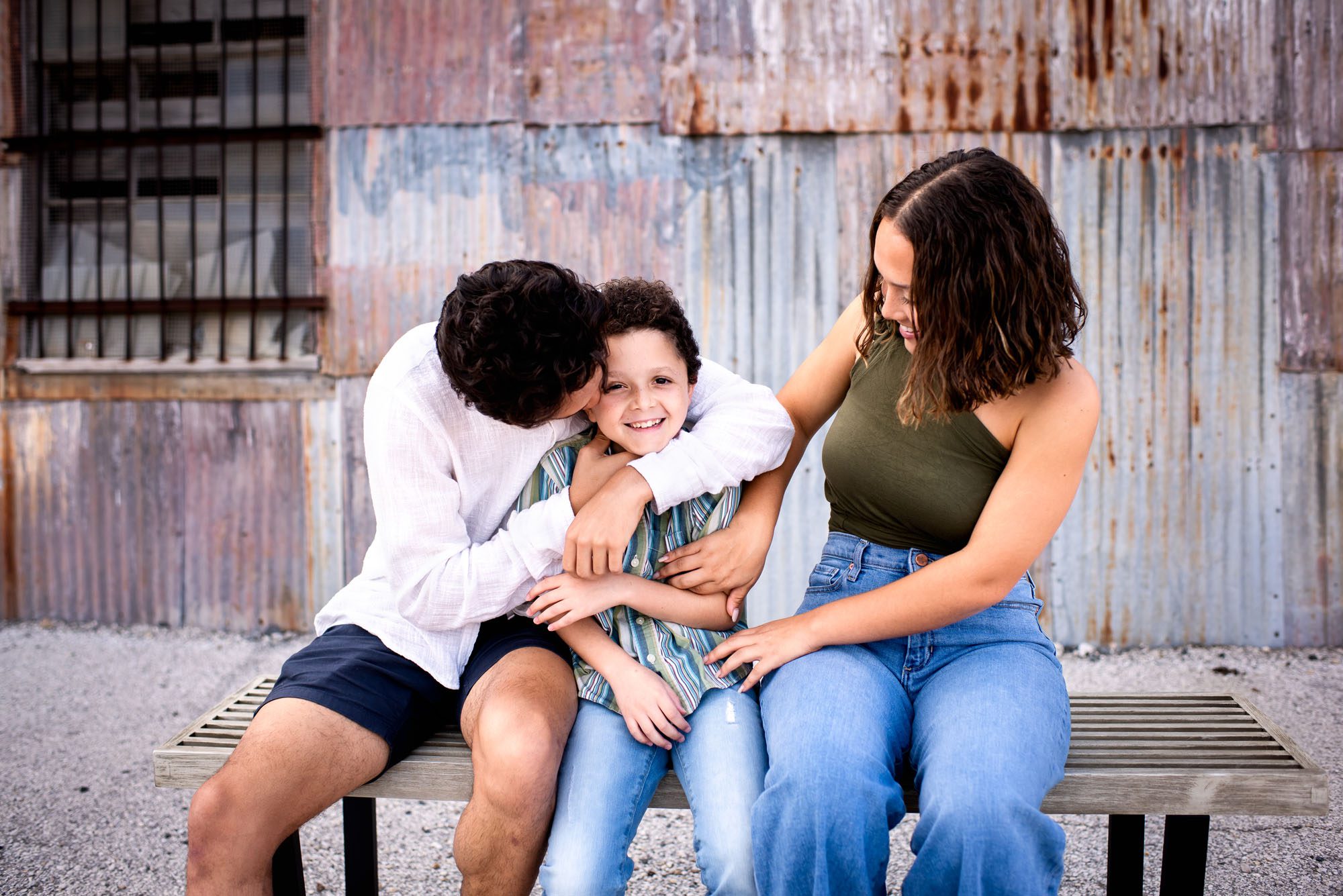 Siblings playing by urban building, San Antonio lifestyle photographer