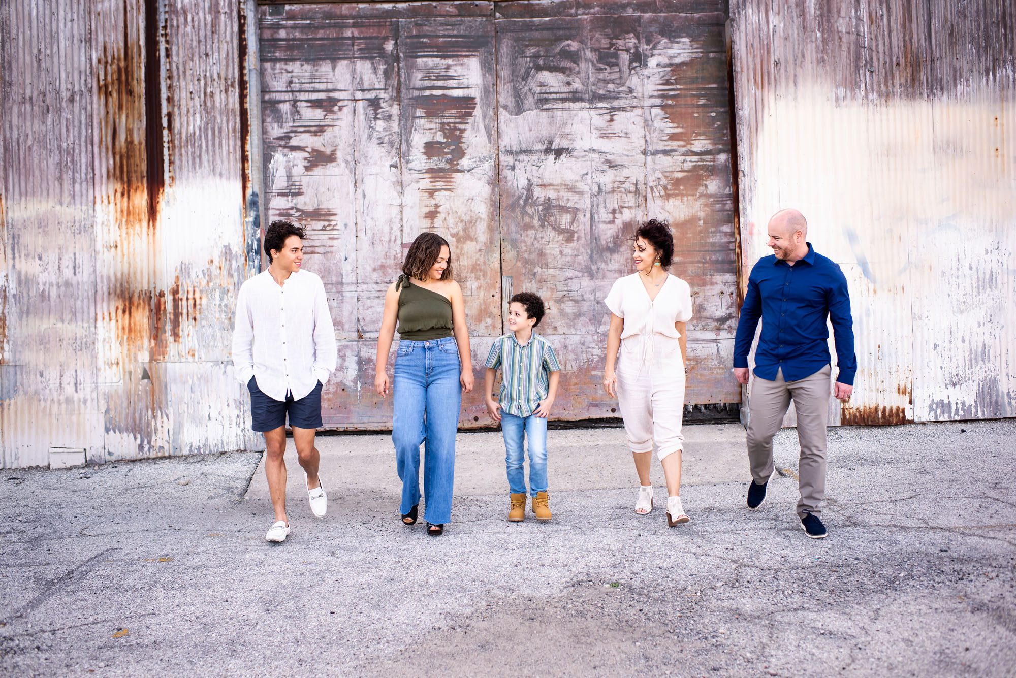 Family walking in front of urban building, San Antonio lifestyle photographer