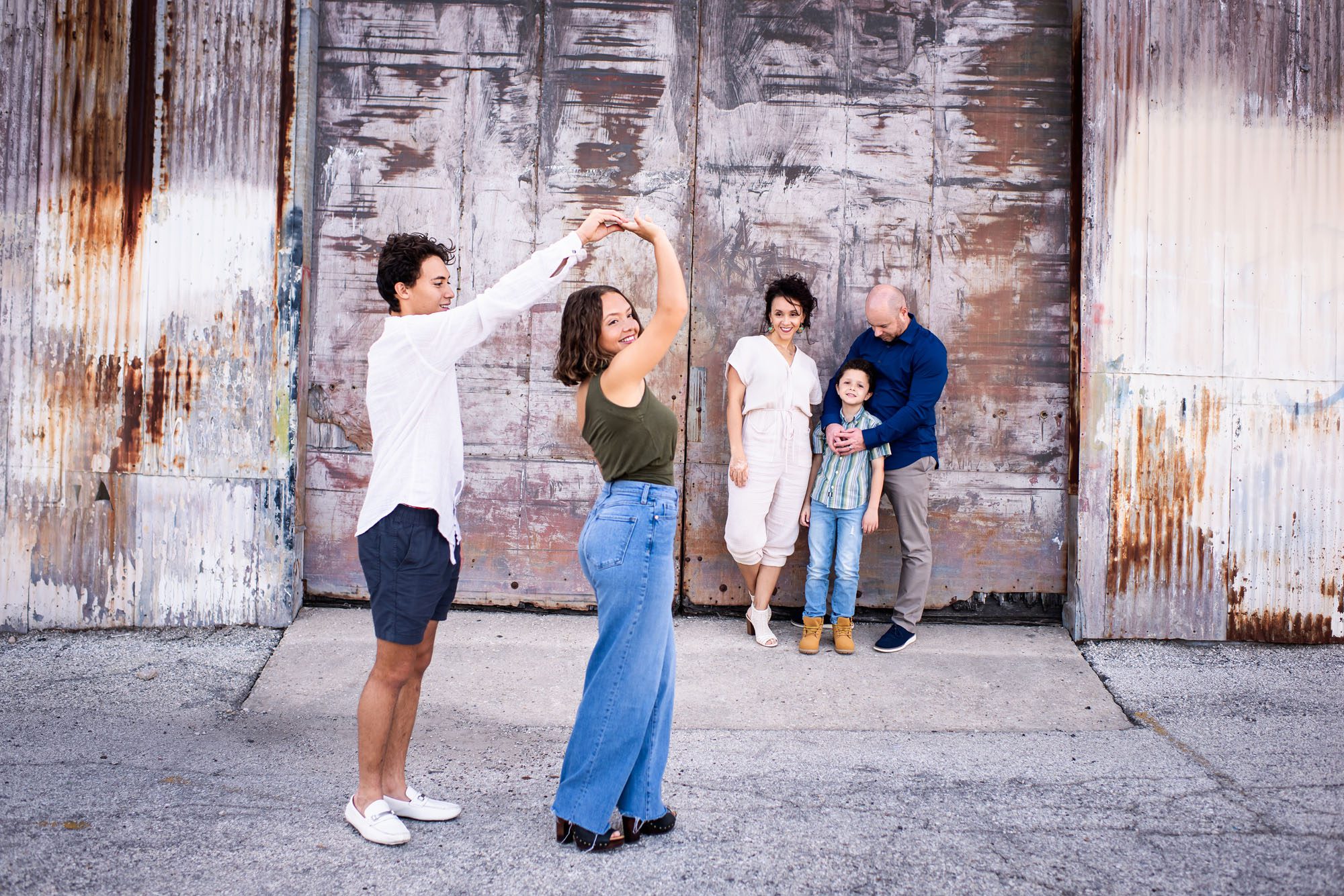 Family in front of urban building, San Antonio lifestyle photographer