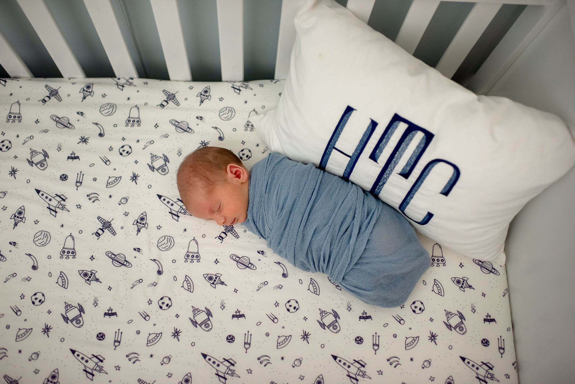 Newborn baby asleep in crib, San Antonio newborn photographer