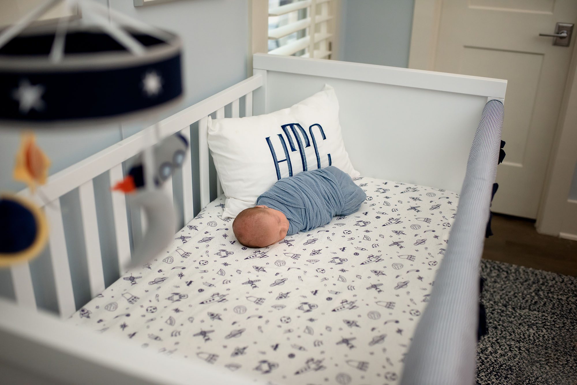 Newborn baby asleep in crib, San Antonio newborn photographer