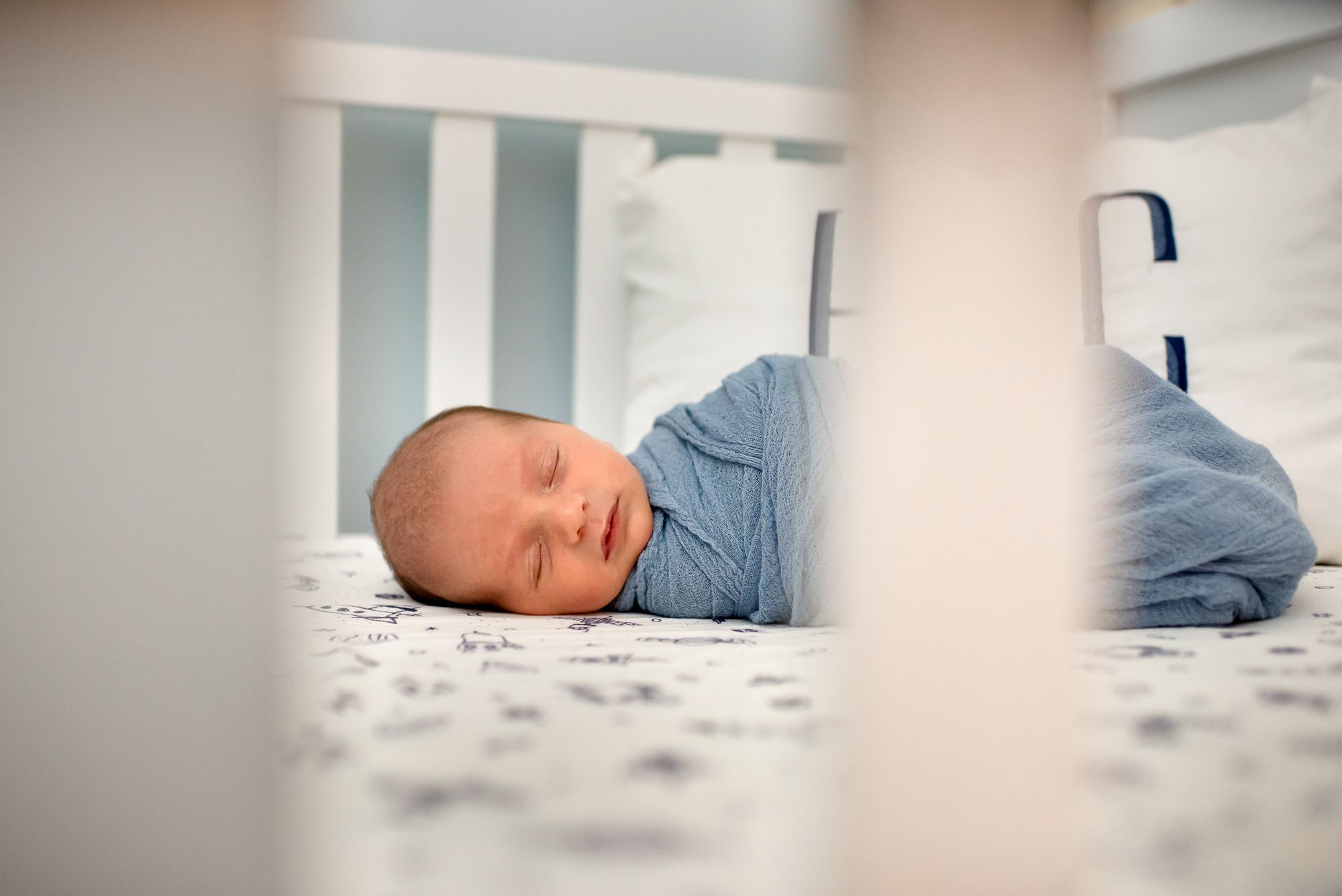 Newborn baby sleeping in crib, San Antonio newborn photographer