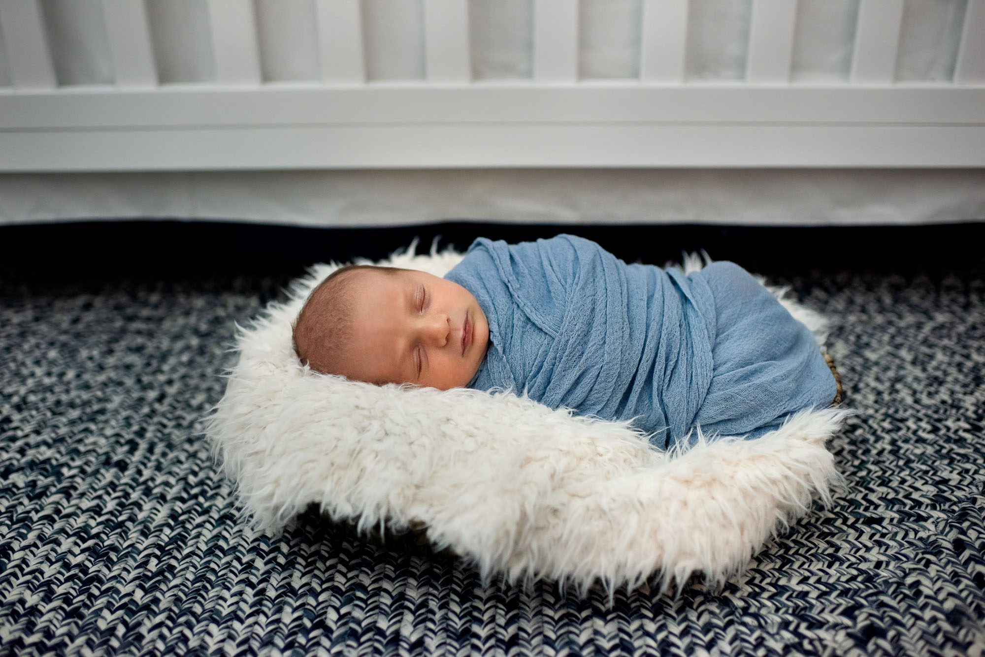 Newborn baby boy sleeping in basket, San Antonio newborn photographer