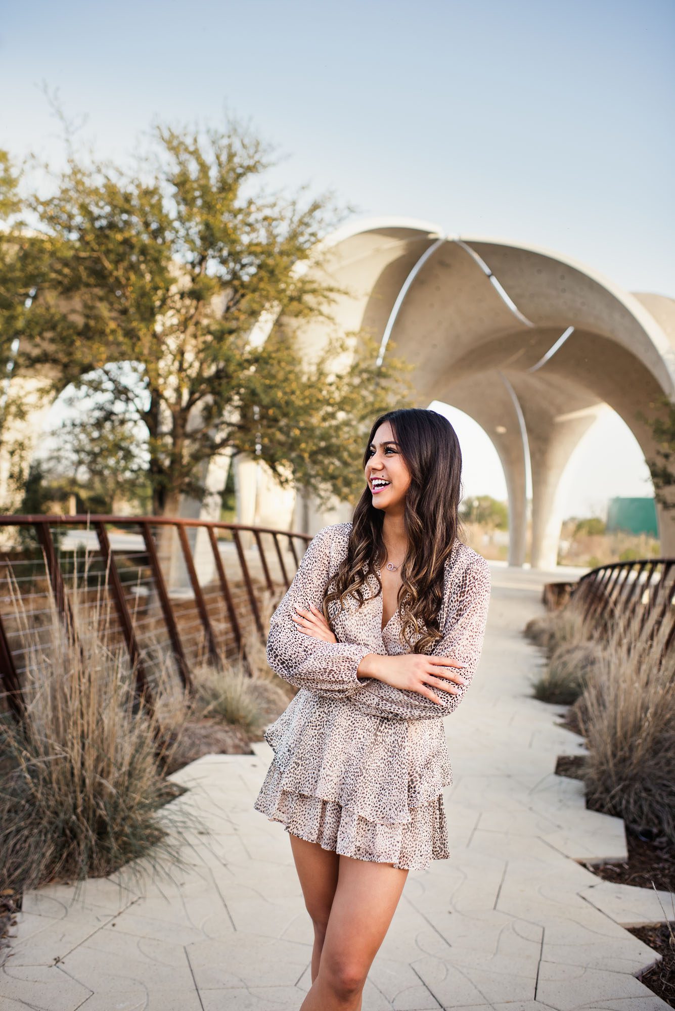 Girl standing in front of arches, San Antonio Senior Portraits