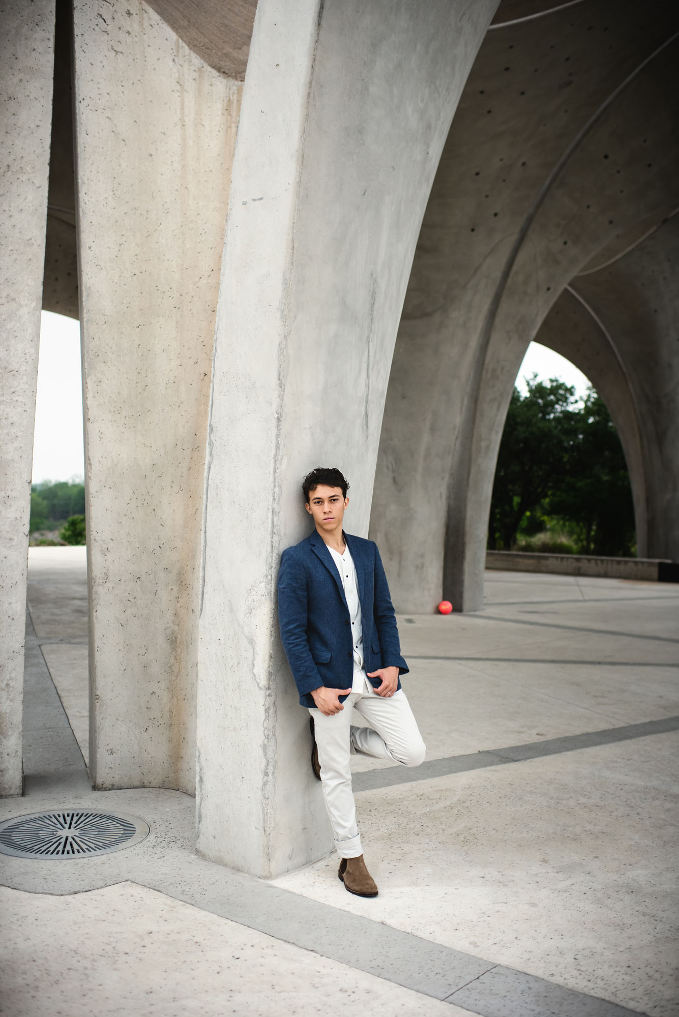 Boy leaning against cement structure, San Antonio Senior Photographer