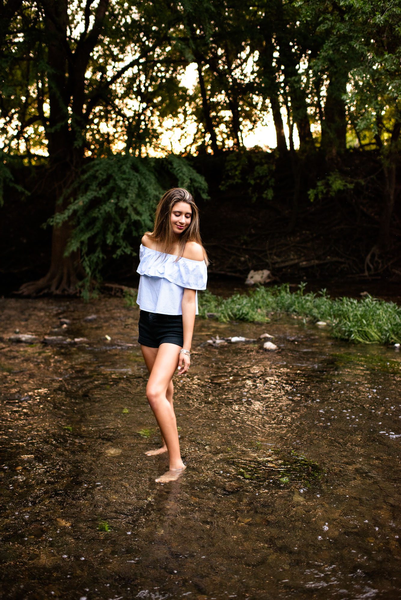 Senior girl standing in shallow creek, Best San Antonio Senior Photographer