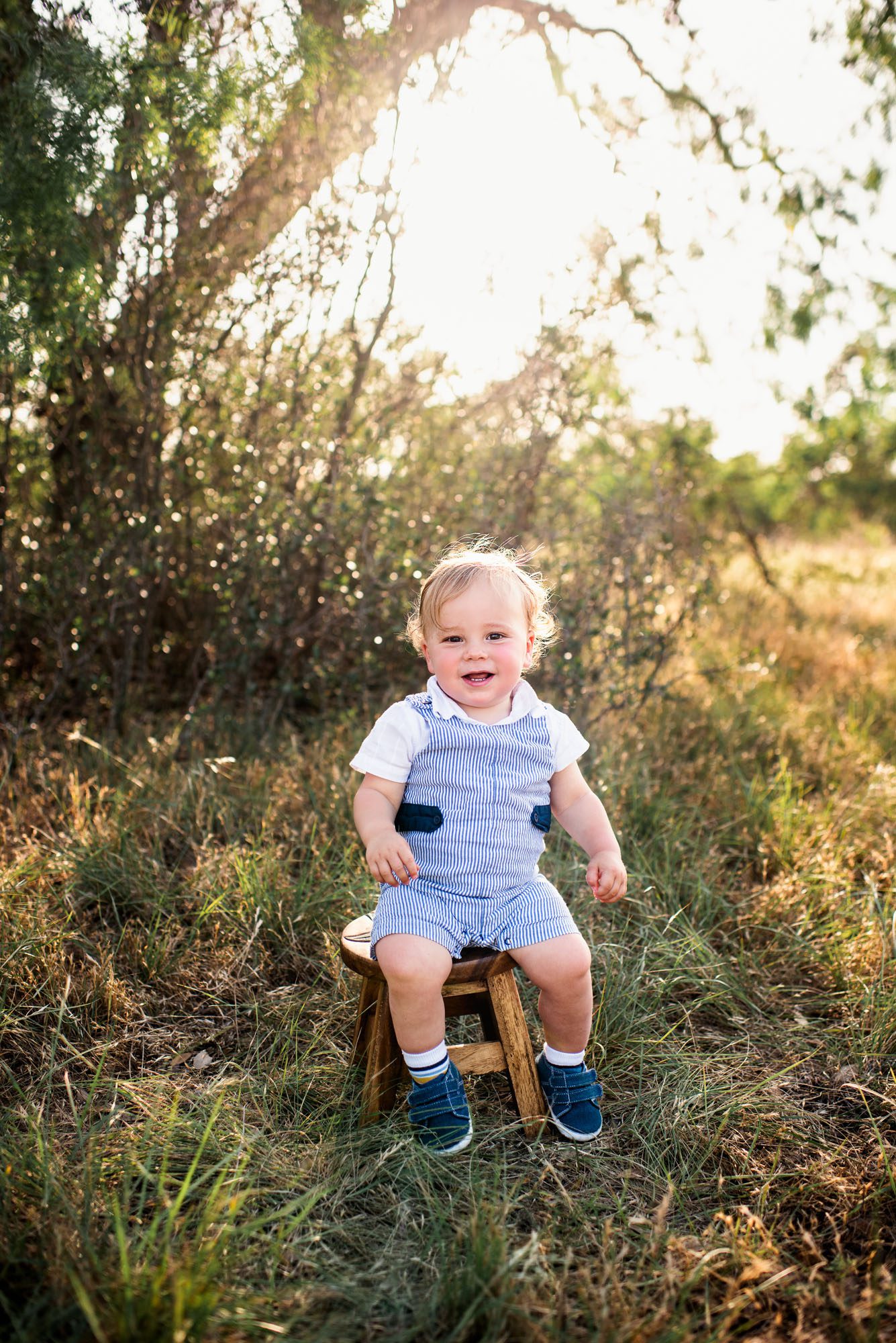 Baby sitting on stool in the grass, San Antonio family photographer