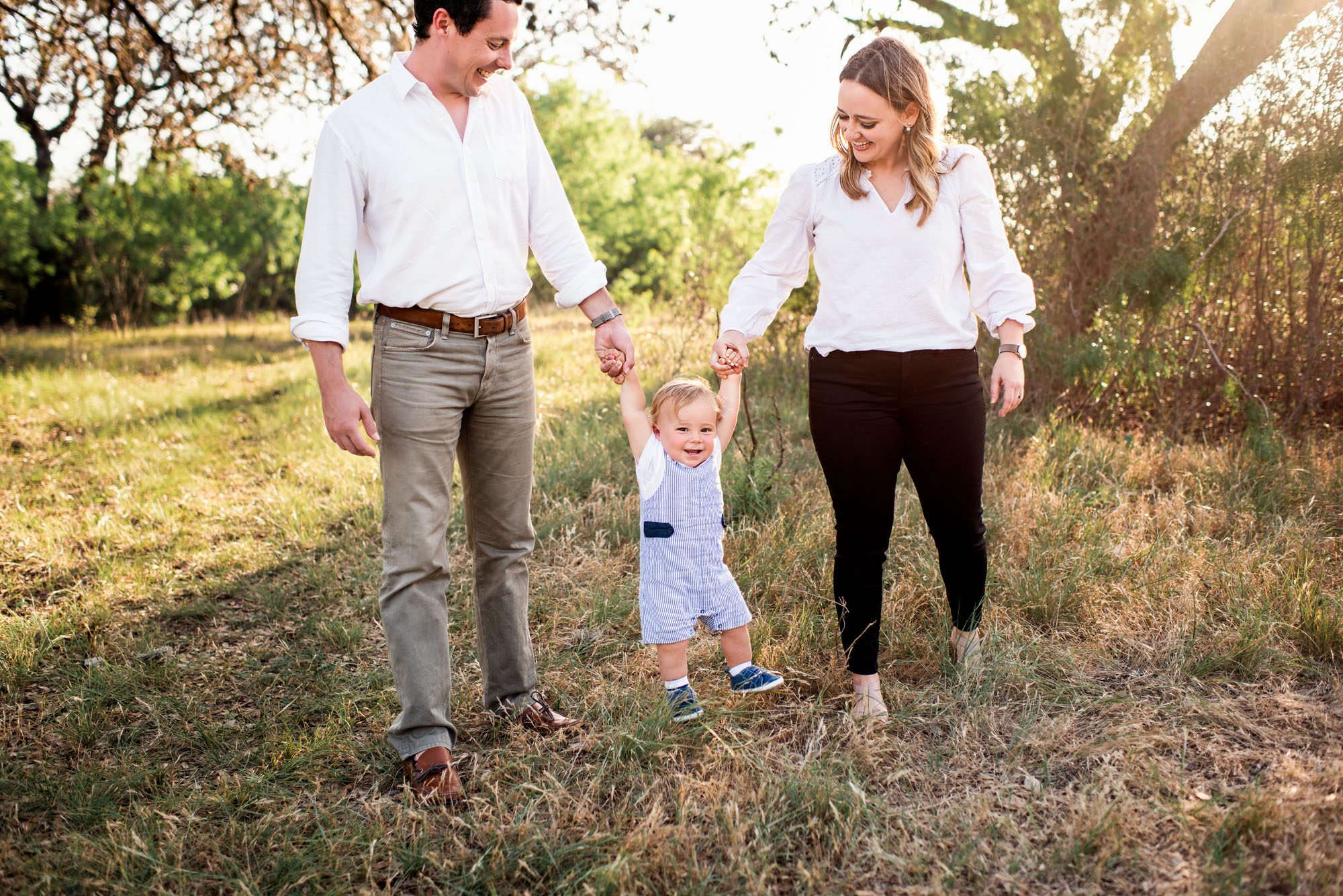 Baby boy swinging with parents, San Antonio lifestyle photographer