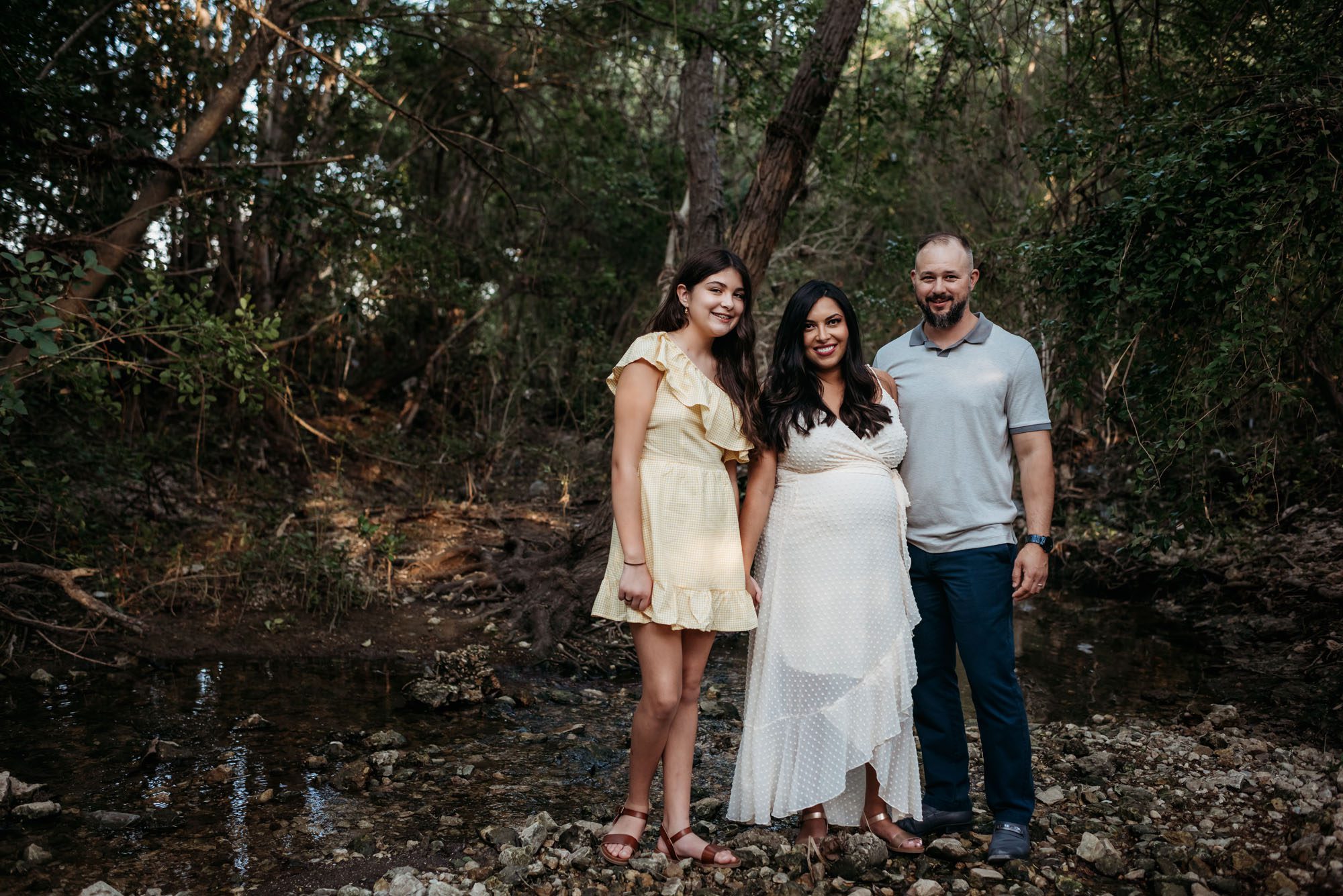 Family standing by creek, San Antonio Maternity Photographer