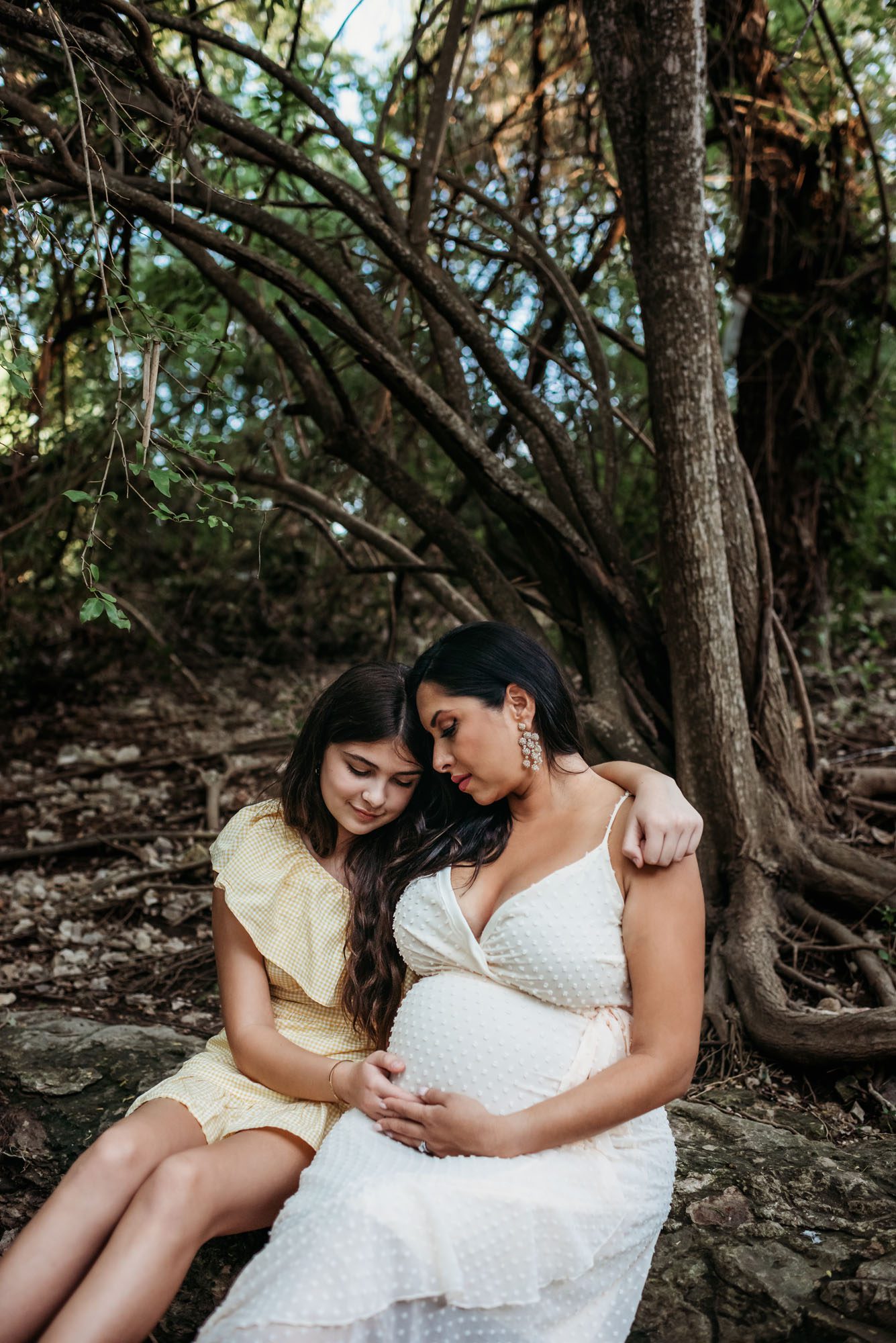 Expectant mother with daughter by a creek, San Antonio Maternity Photographer