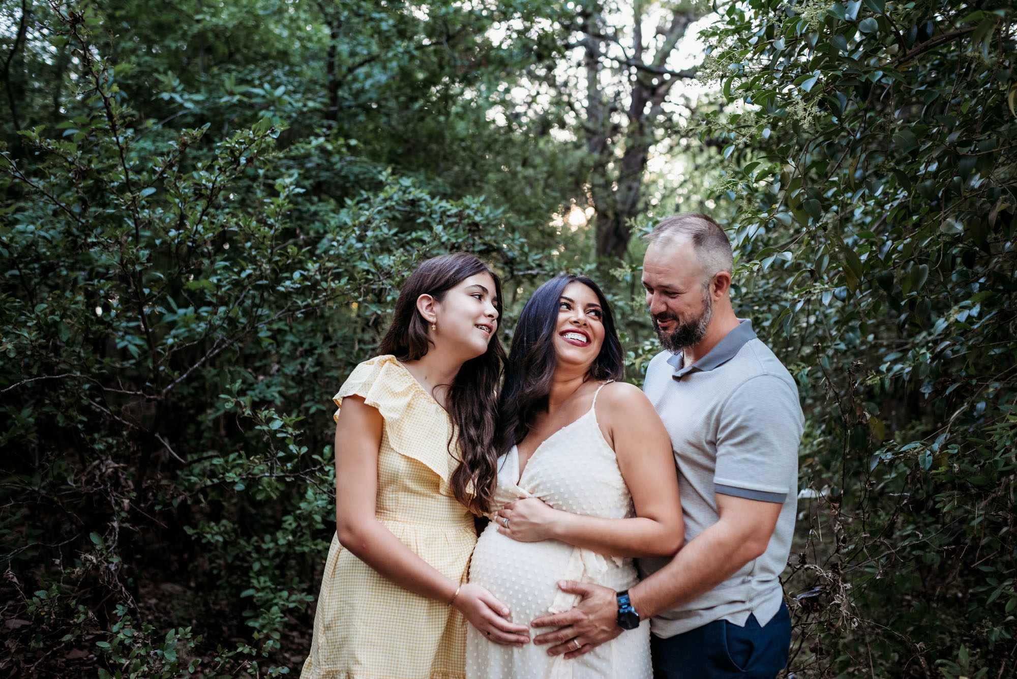 Expectant mother smiling at family, San Antonio Maternity Photographer