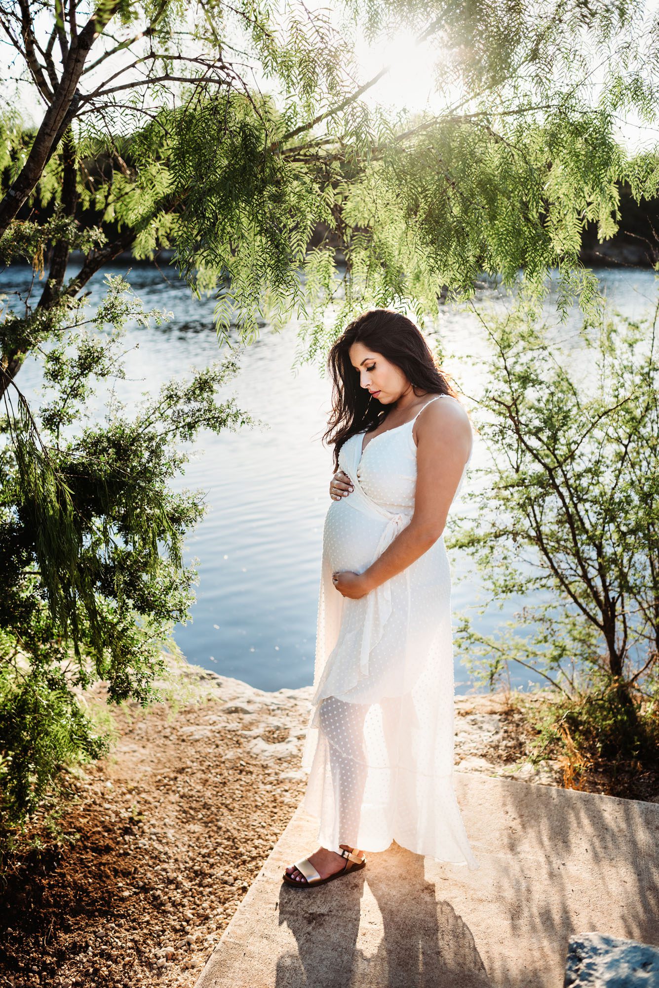 Pregnant mother standing near lake at sunset, San Antonio Maternity Photographer