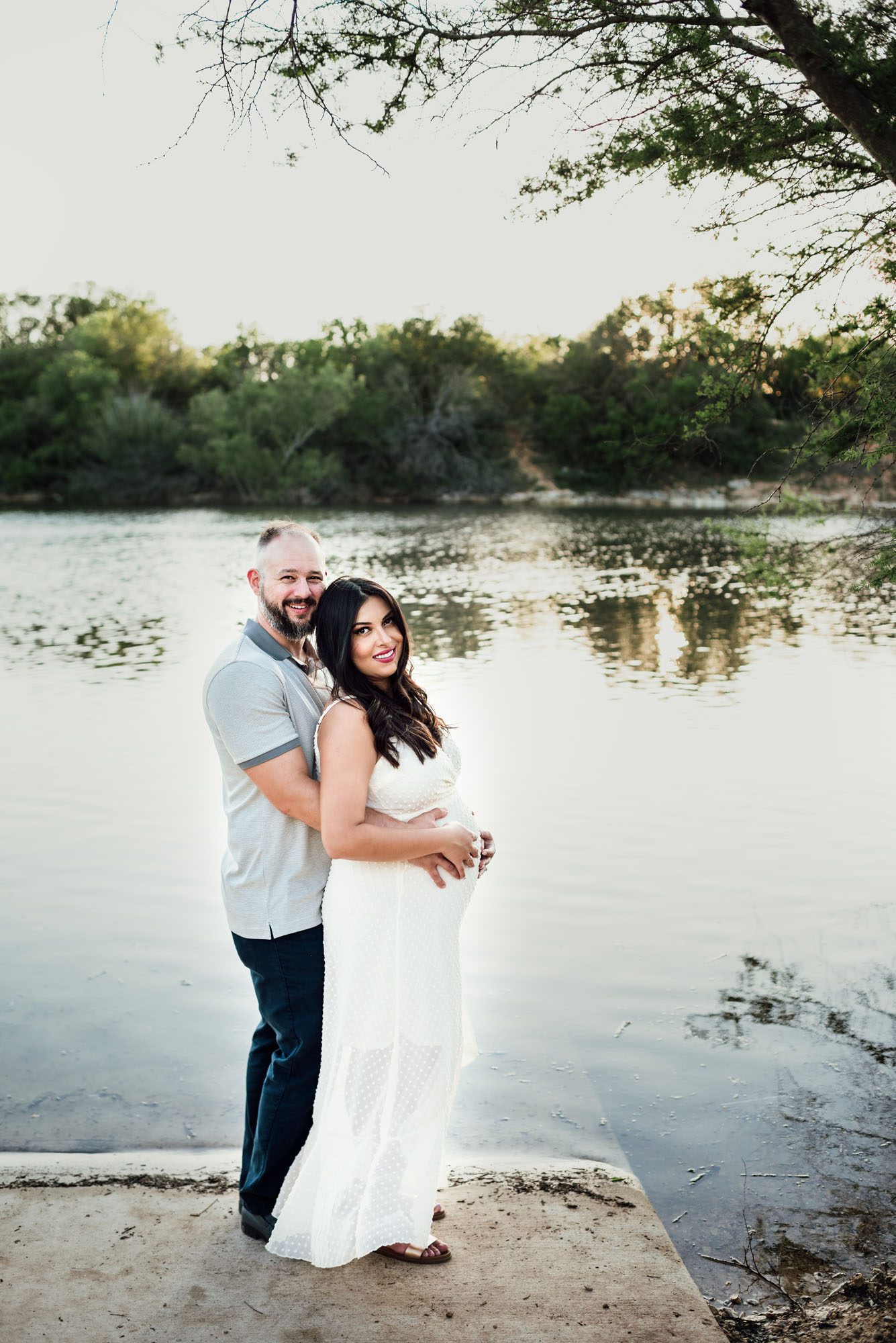 Couple standing together by the lake, San Antonio Maternity Lifestyle Photographer