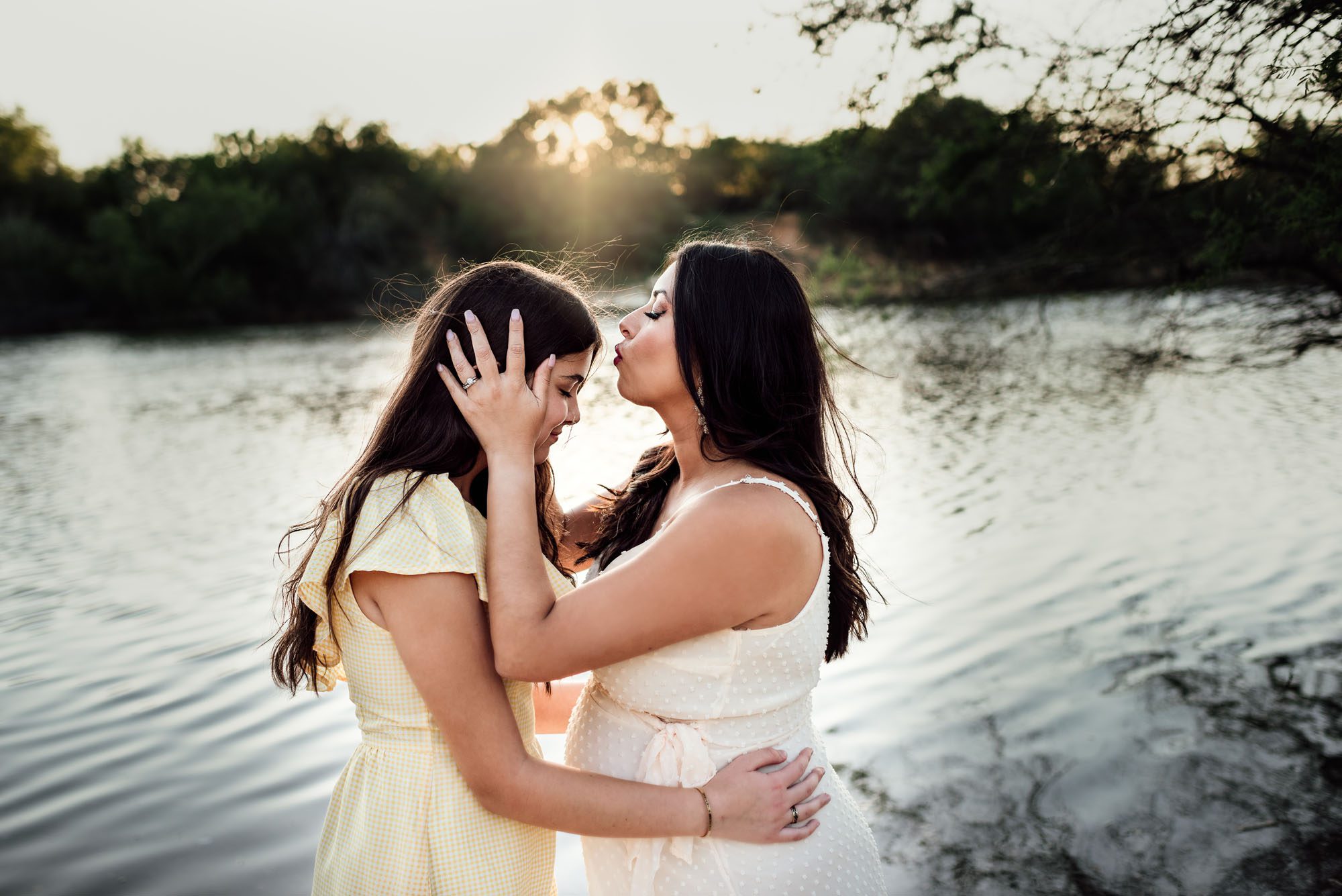 Mother kissing daughter's head, San Antonio Maternity Lifestyle Photographer