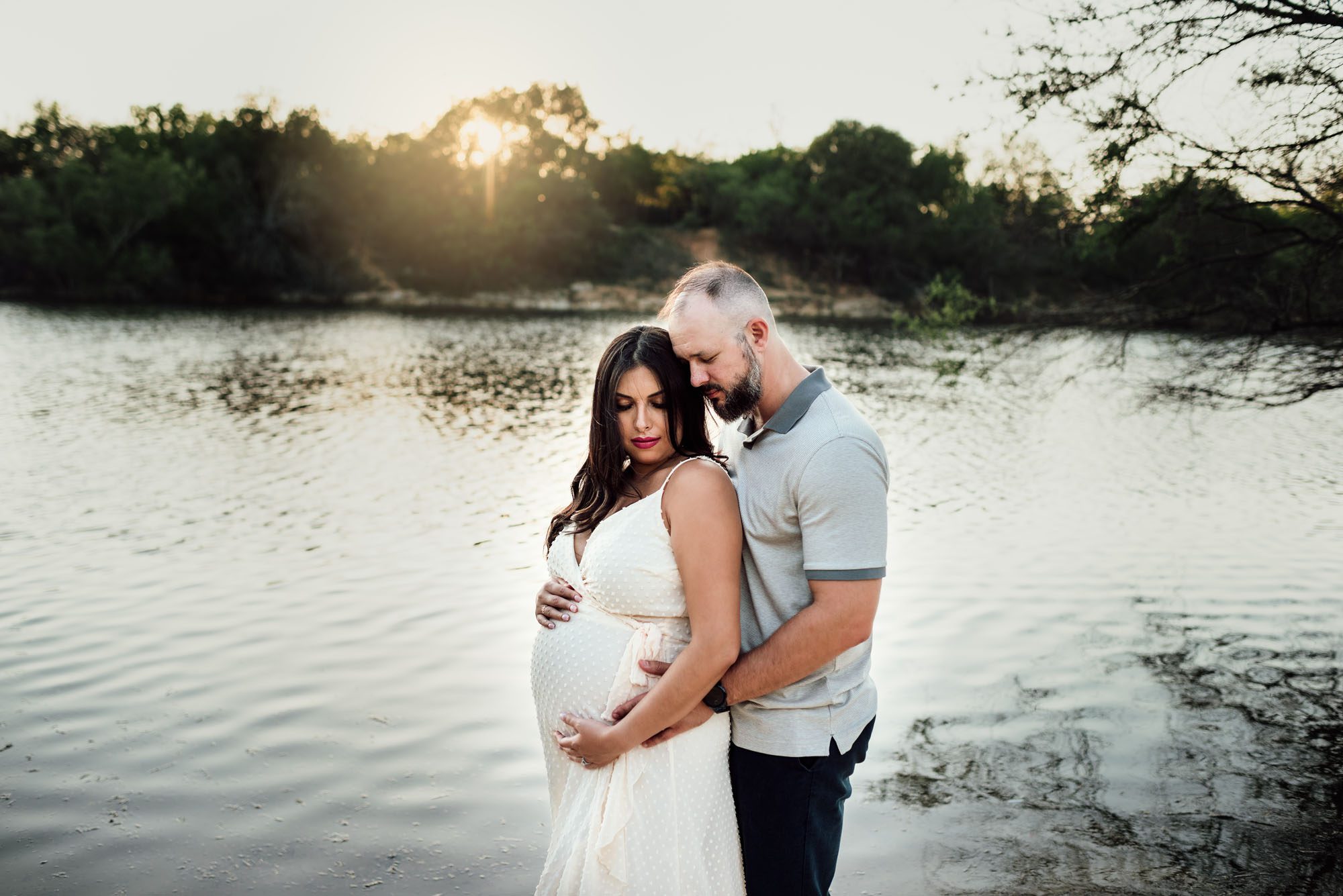 Couple standing by the lake at sunset, San Antonio Maternity Lifestyle Photographer