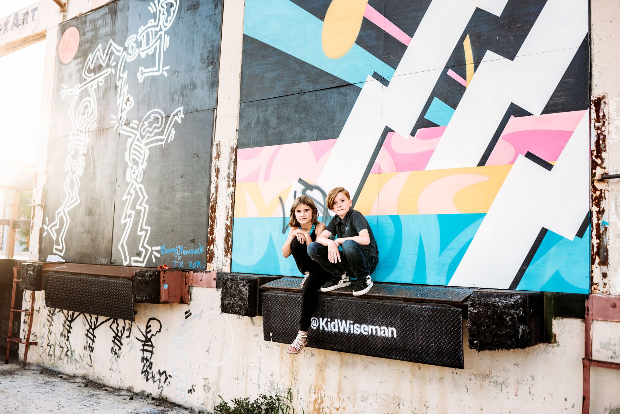 Kids sitting by colorful art mural, Best San Antonio lifestyle photographer