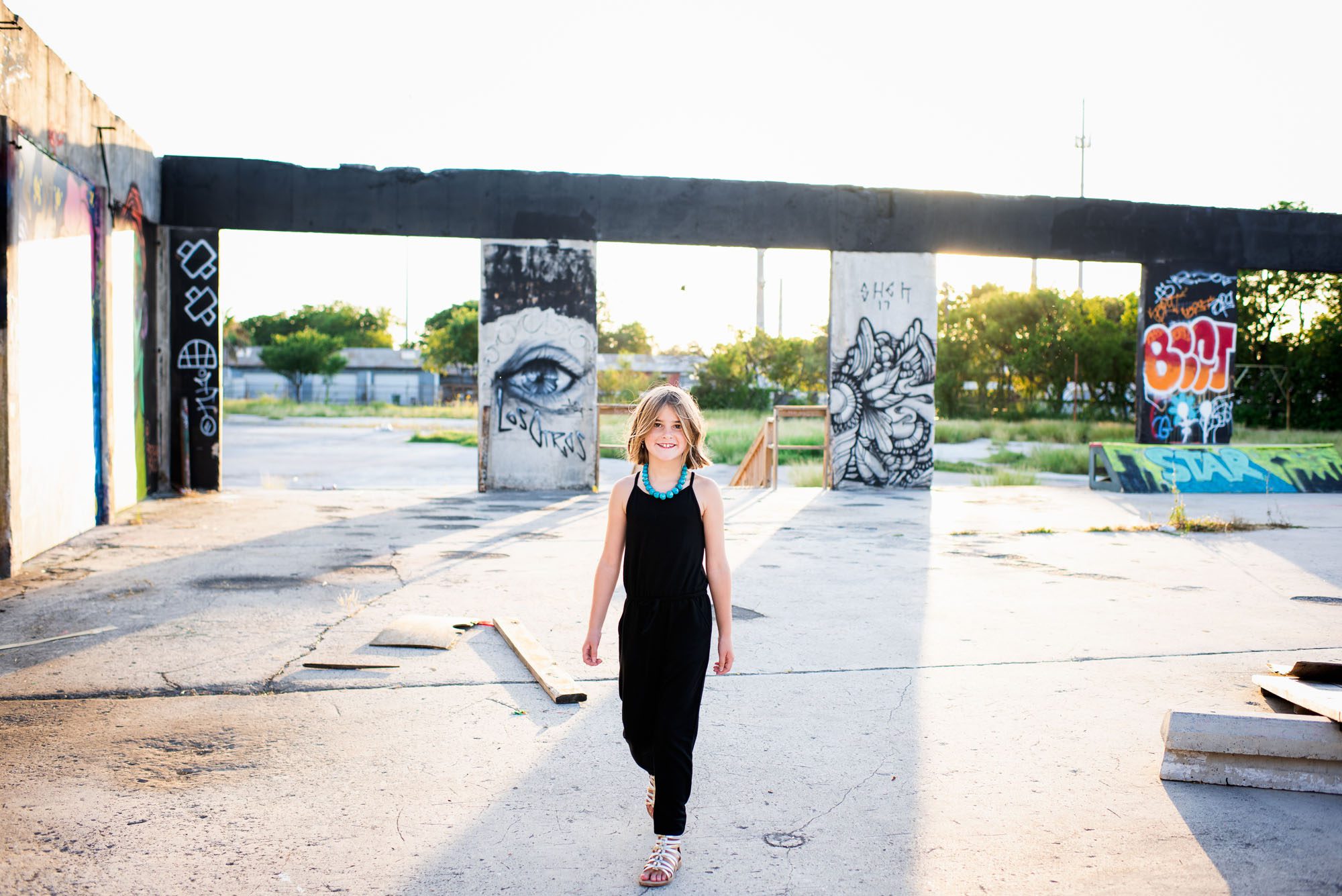 Girl walking by grafitti wall, San Antonio lifestyle photographer