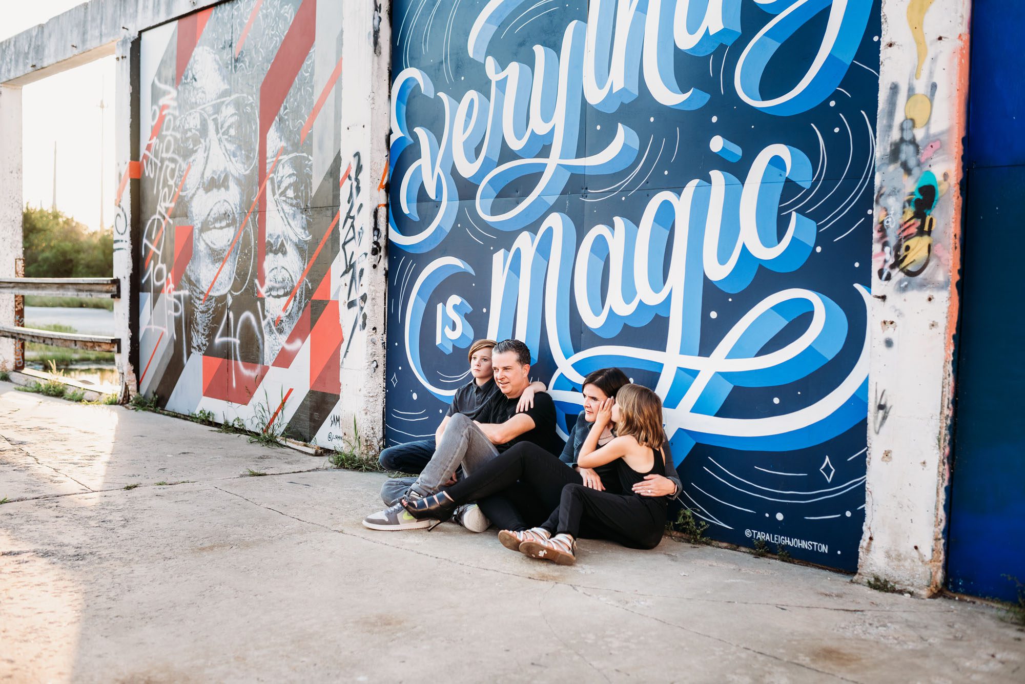 Family sitting by art mural, Best San Antonio lifestyle photographer