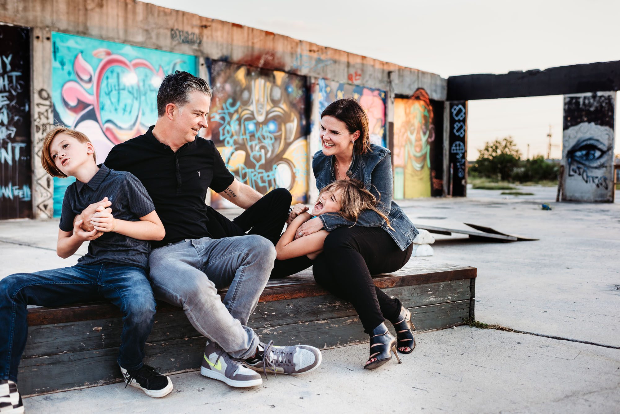 Family sitting and tickling kids, San Antonio Lifestyle photographer