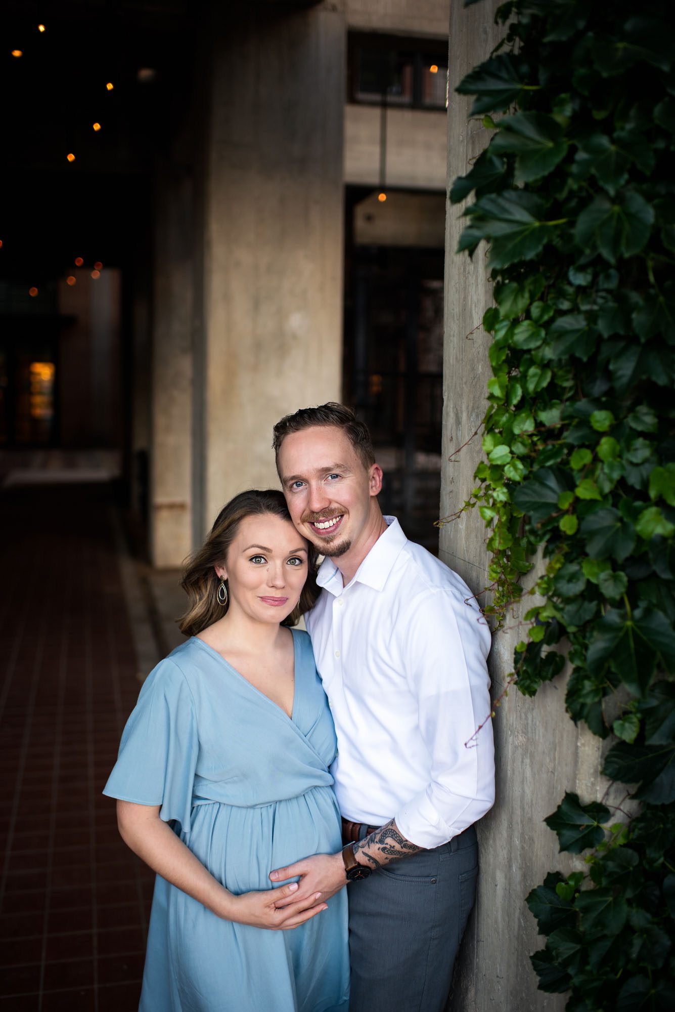 Expectant couple by a hallway, San Antonio maternity photographer