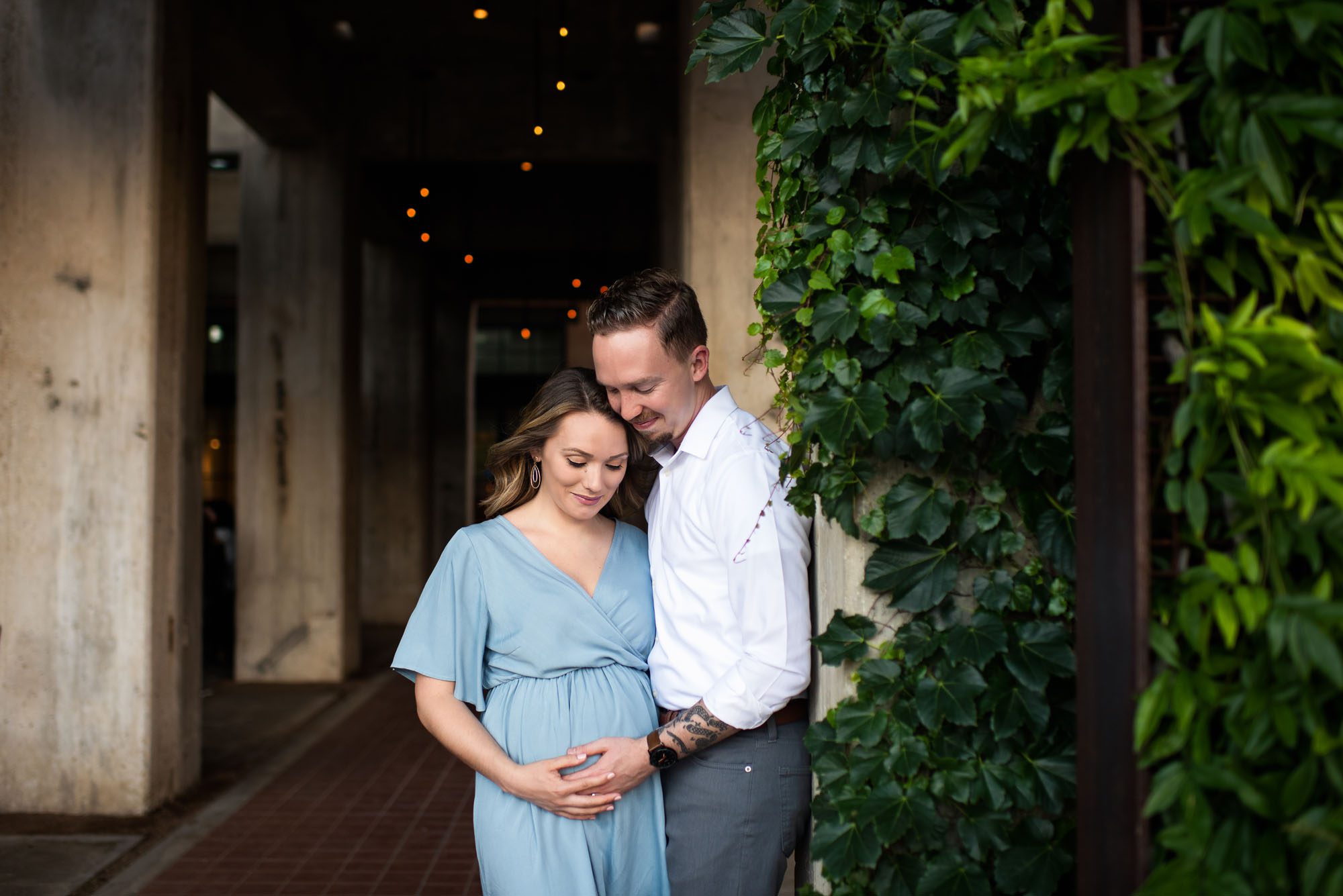 Expectant couple looking at baby belly, San Antonio maternity photographer