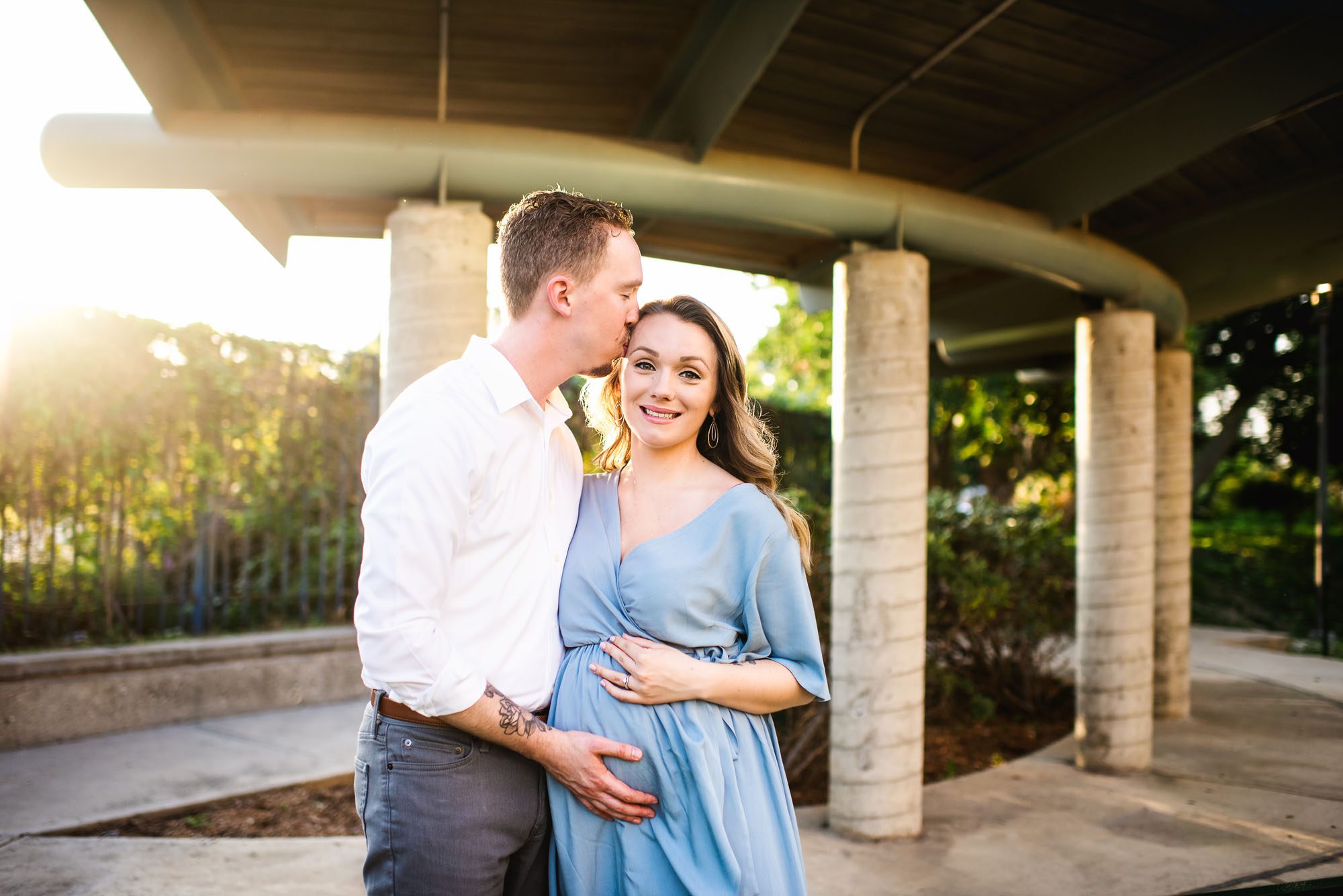 Expectant couple kissing at sunset, San Antonio maternity photographer
