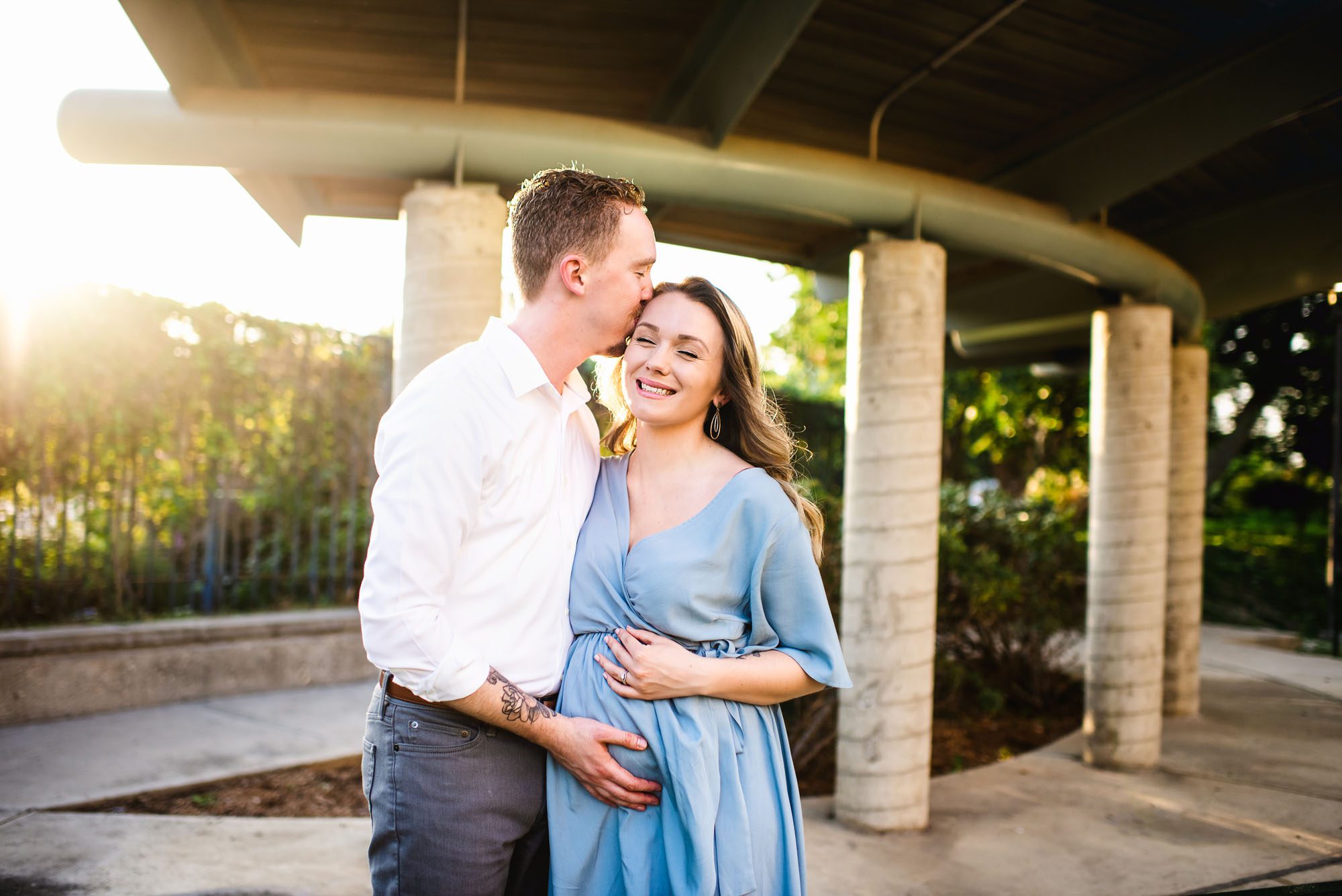Expectant couple kissing at sunset, San Antonio maternity lifestyle photographer