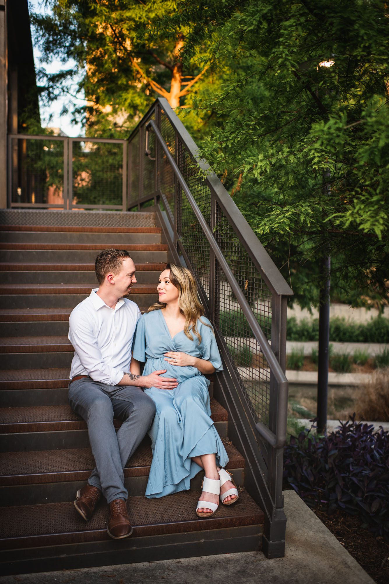 Expectant couple sitting on staircase, Best San Antonio maternity photographer