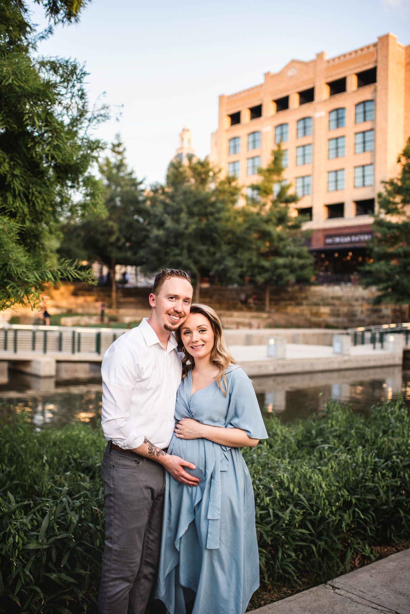 Pregnant couple by Riverwalk, San Antonio maternity photographer