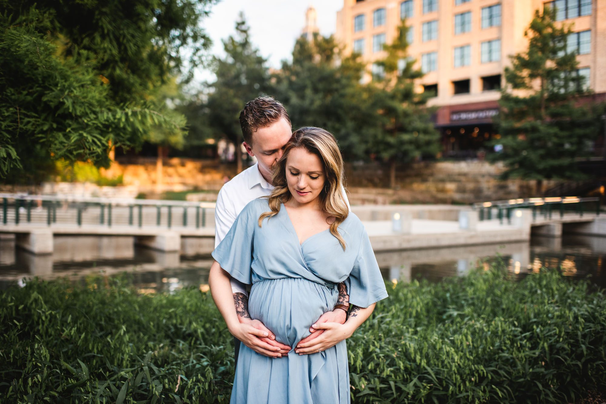 Expectant couple by a river, San Antonio lifestyle maternity photographer