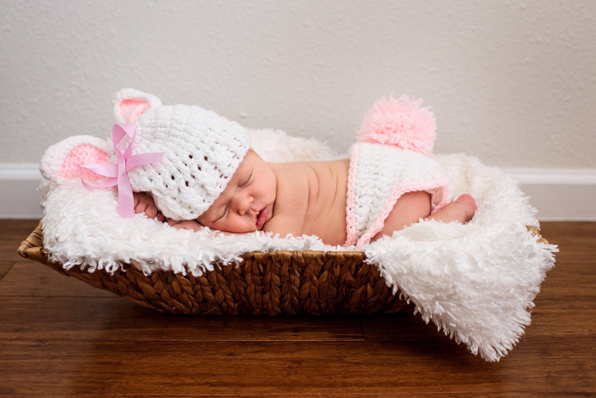 Sleeping newborn baby girl with bunny hat, San Antonio newborn photographer