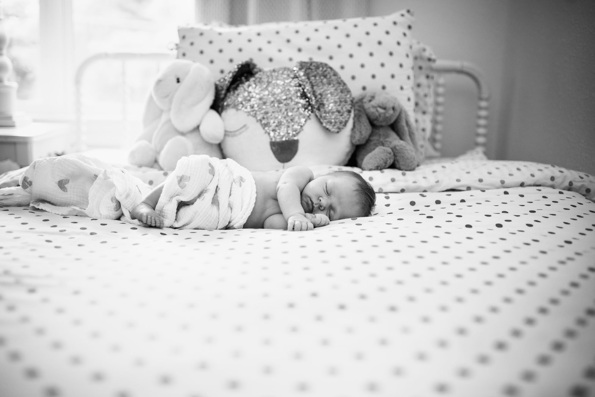 Newborn baby sleeping on bed, San Antonio Lifestyle Newborn Photographer