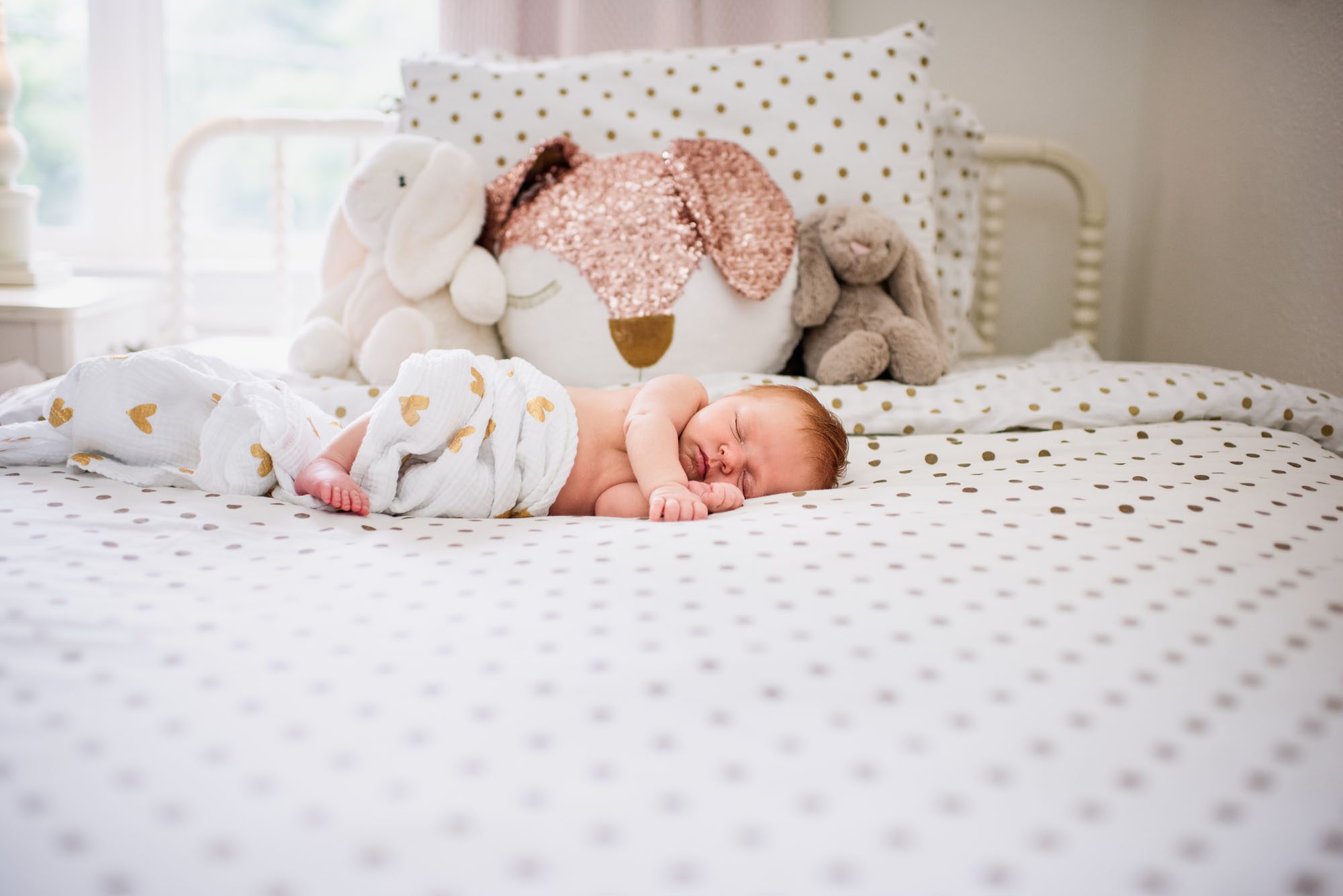 Newborn baby sleeping on bed, San Antonio Lifestyle Newborn Photographer