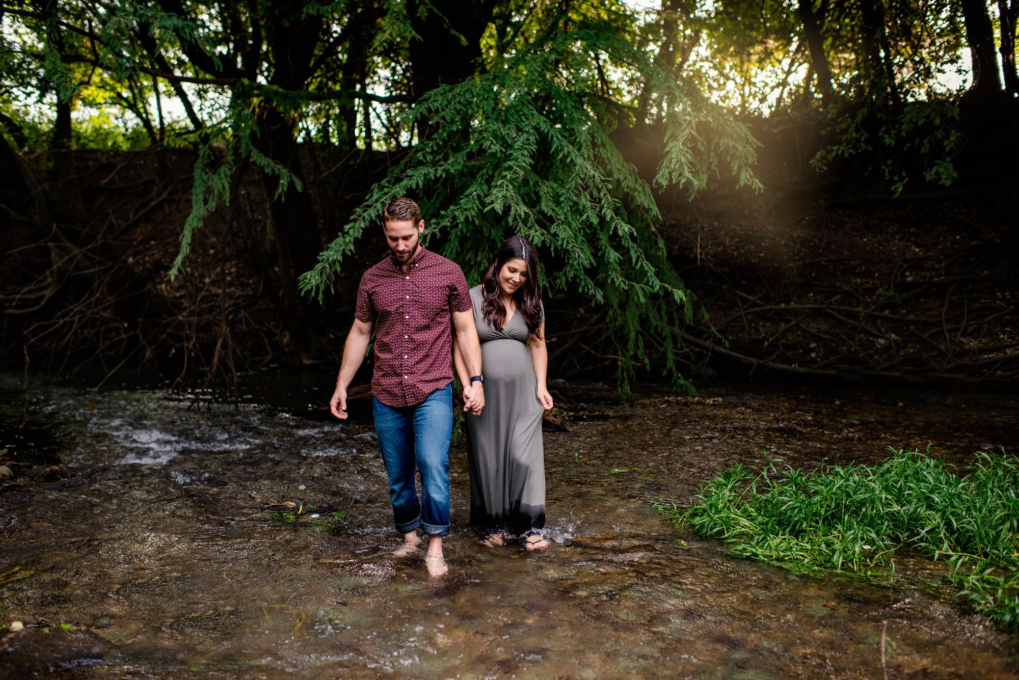 Pregnant couple walking in creek at sunset, San Antonio Maternity Photographer