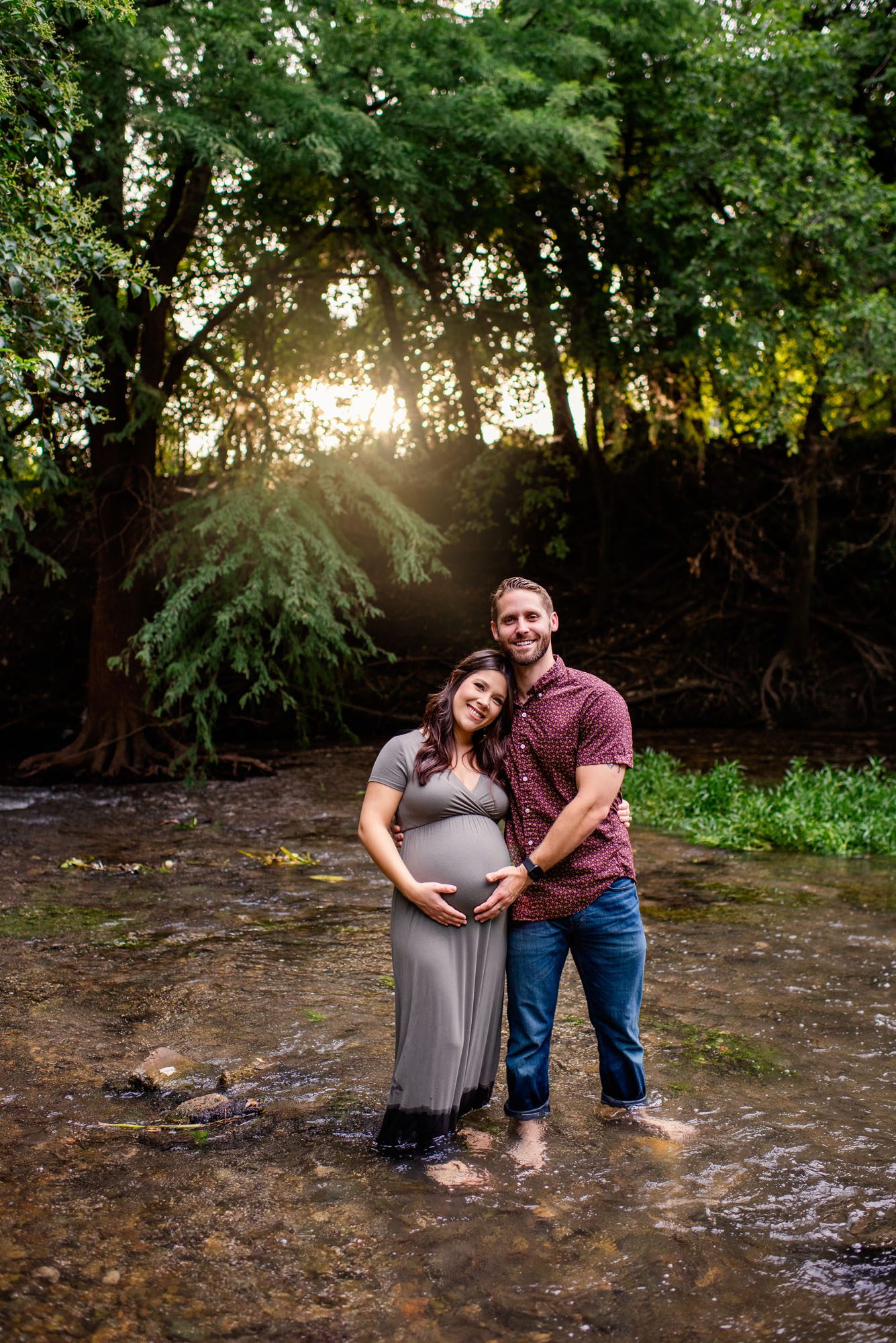 Expectant couple standing in creek at sunset, San Antonio Maternity Photographer