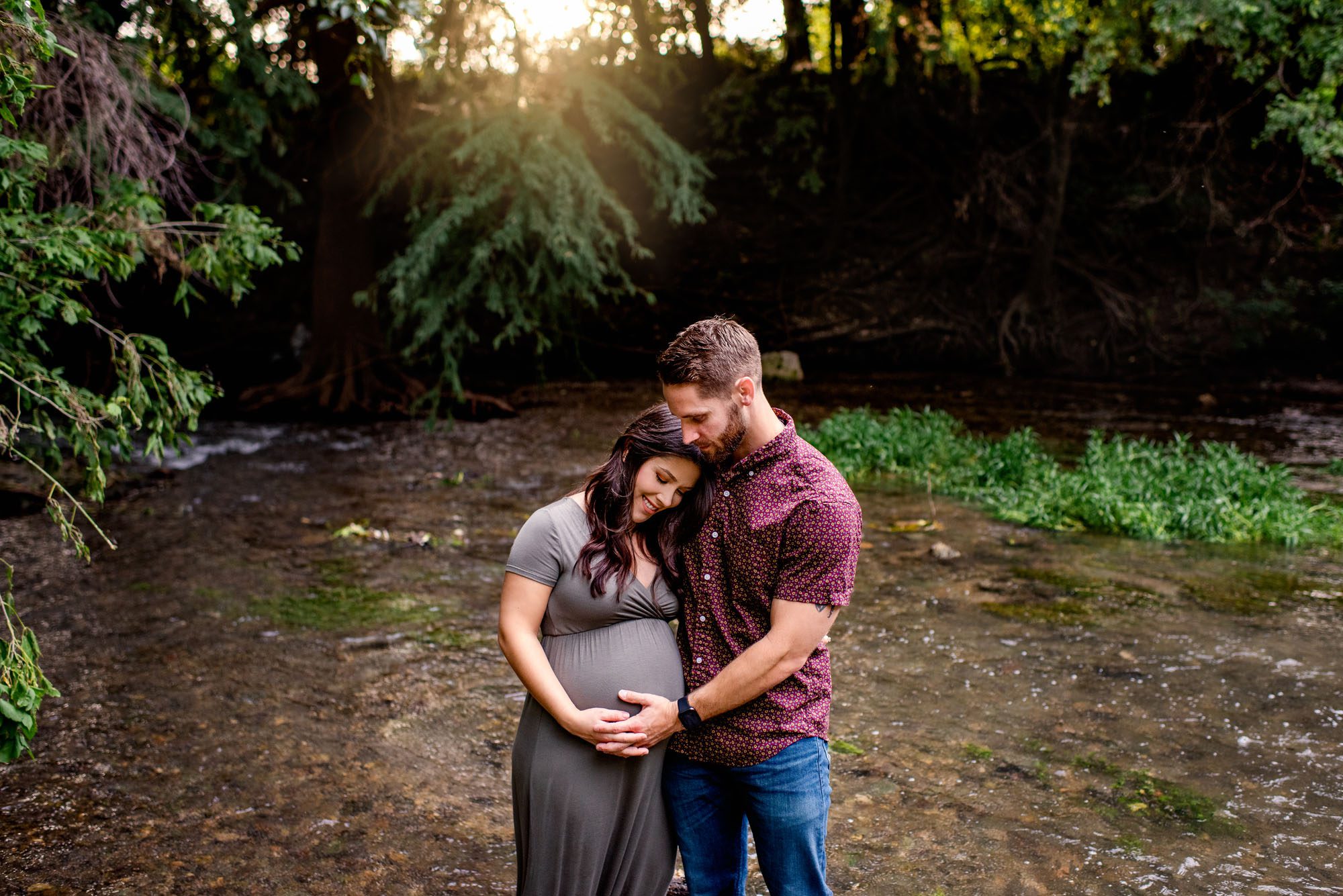 Expectant couple standing in creek at sunset, San Antonio Maternity Photographer
