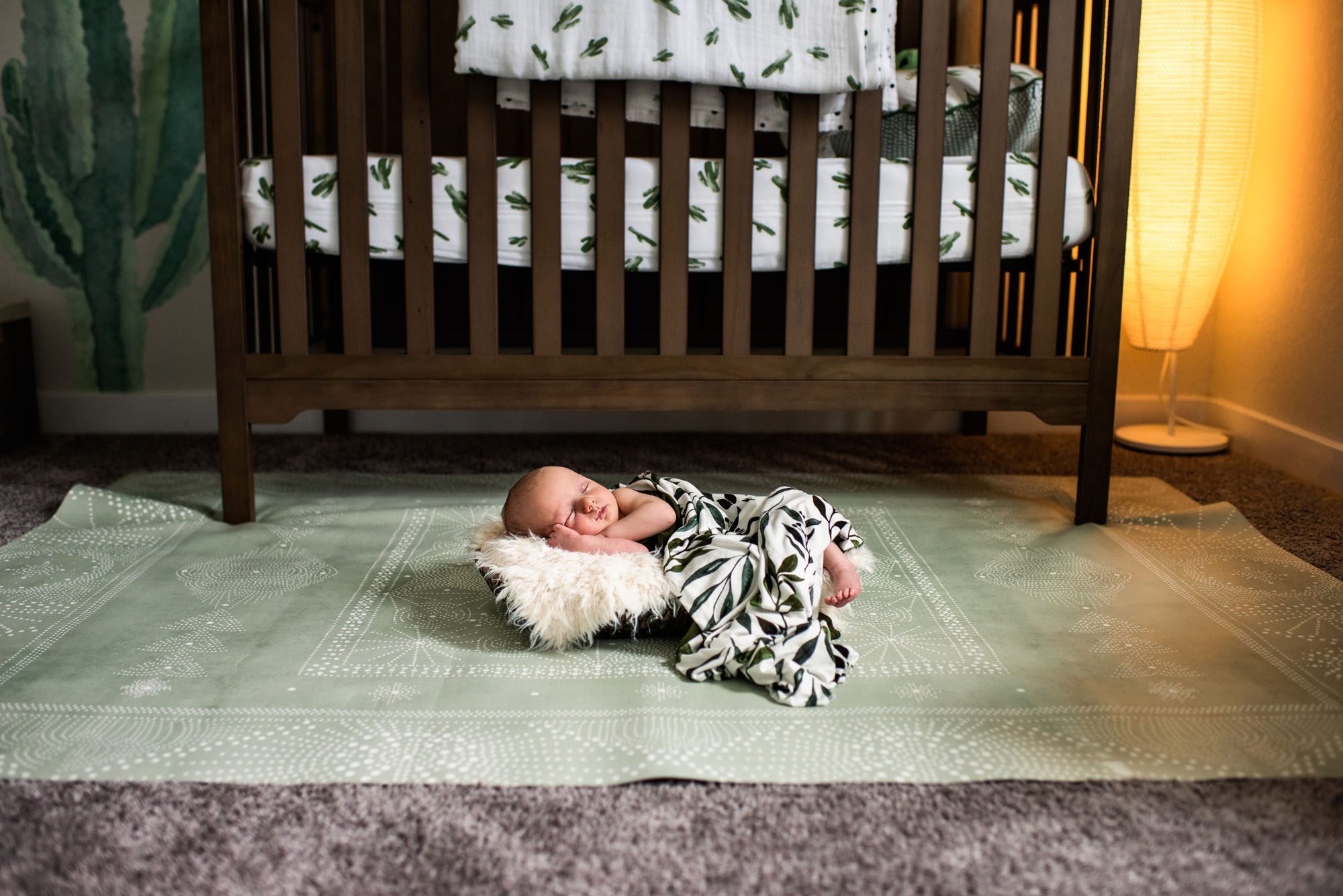 Best San Antonio Newborn Photographer, Baby asleep in basket in green nursery