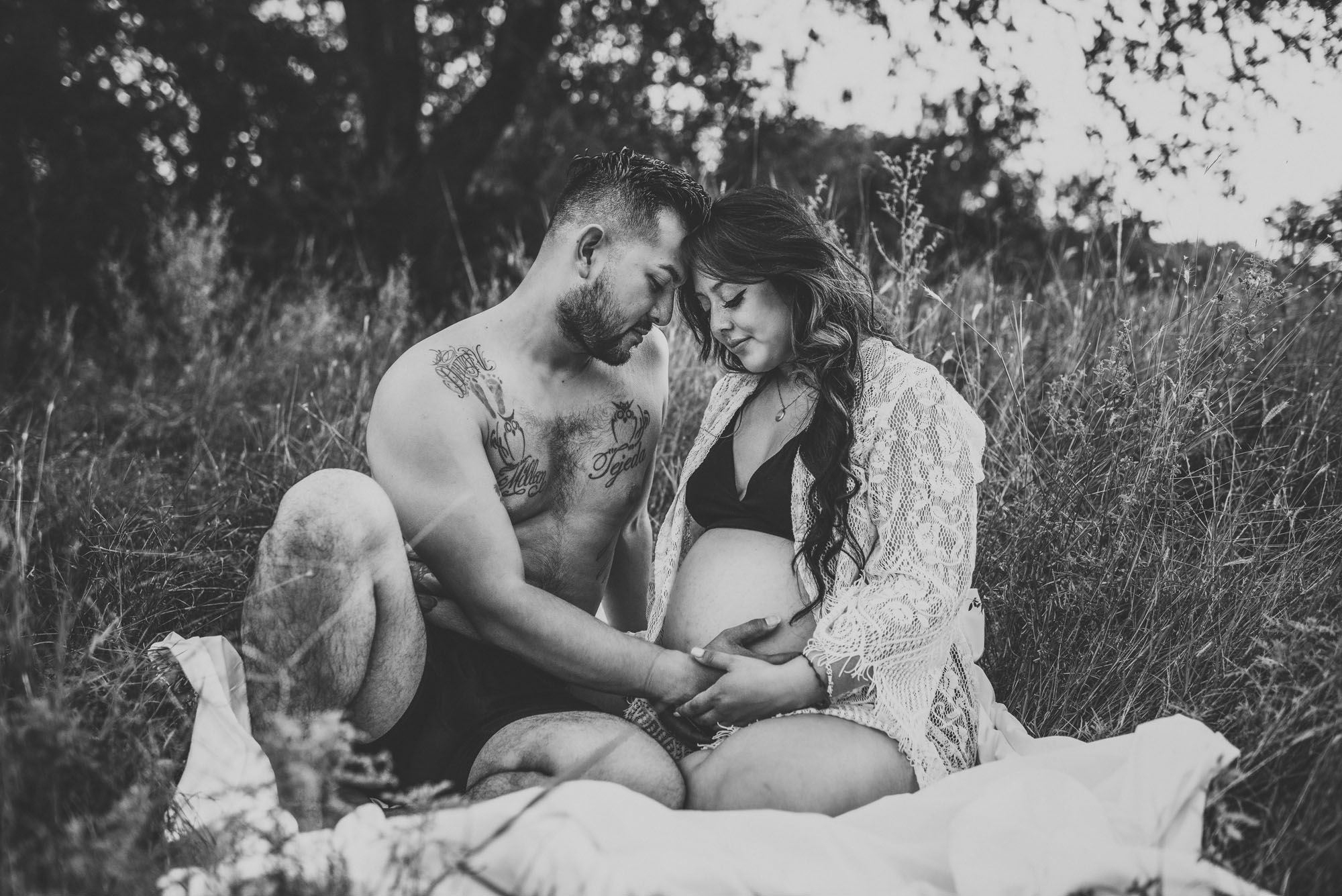 Best San Antonio Maternity Photographer, couple sitting together on a blanket
