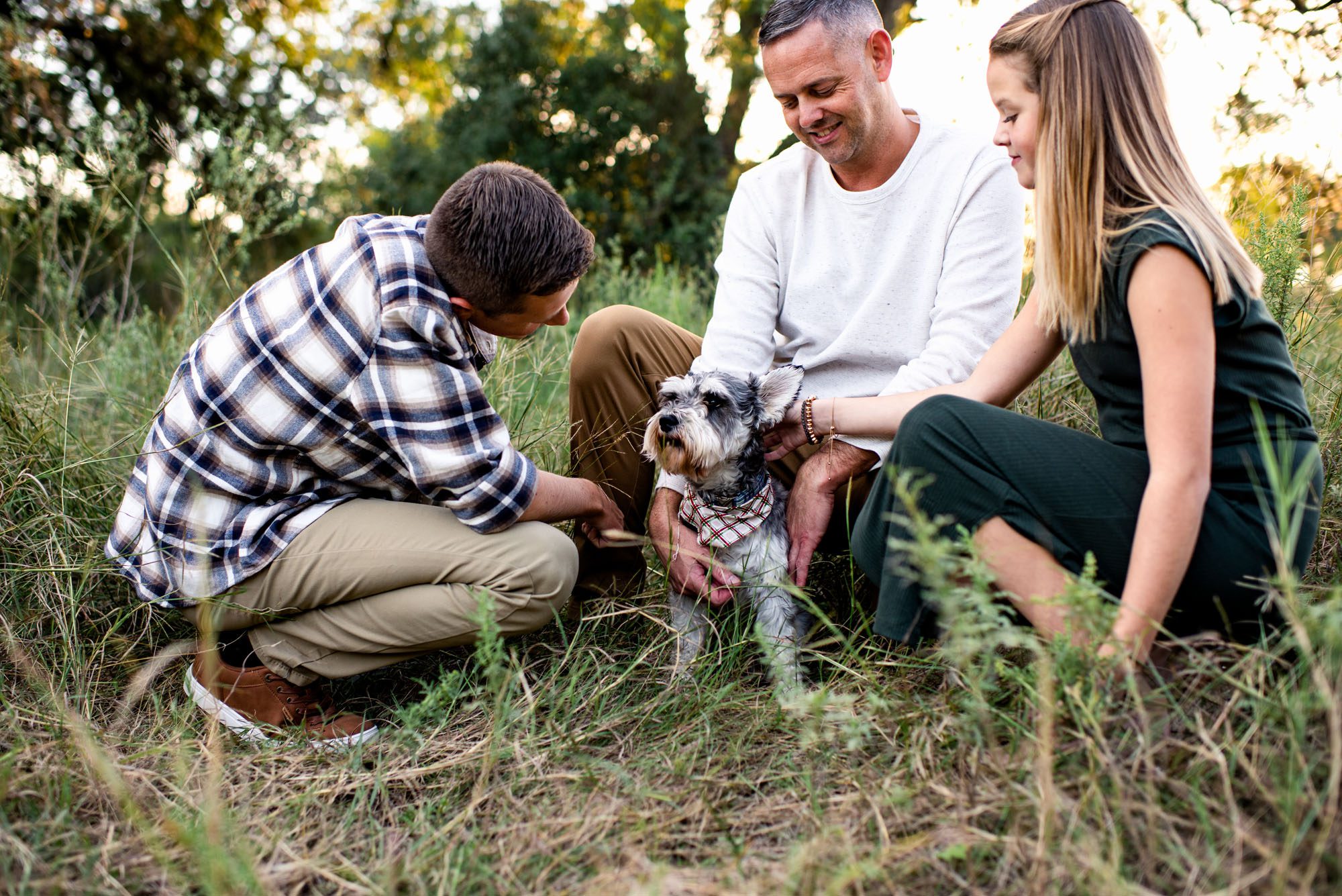 Family playing with dog in the grass, San Antonio Lifestyle Photographer