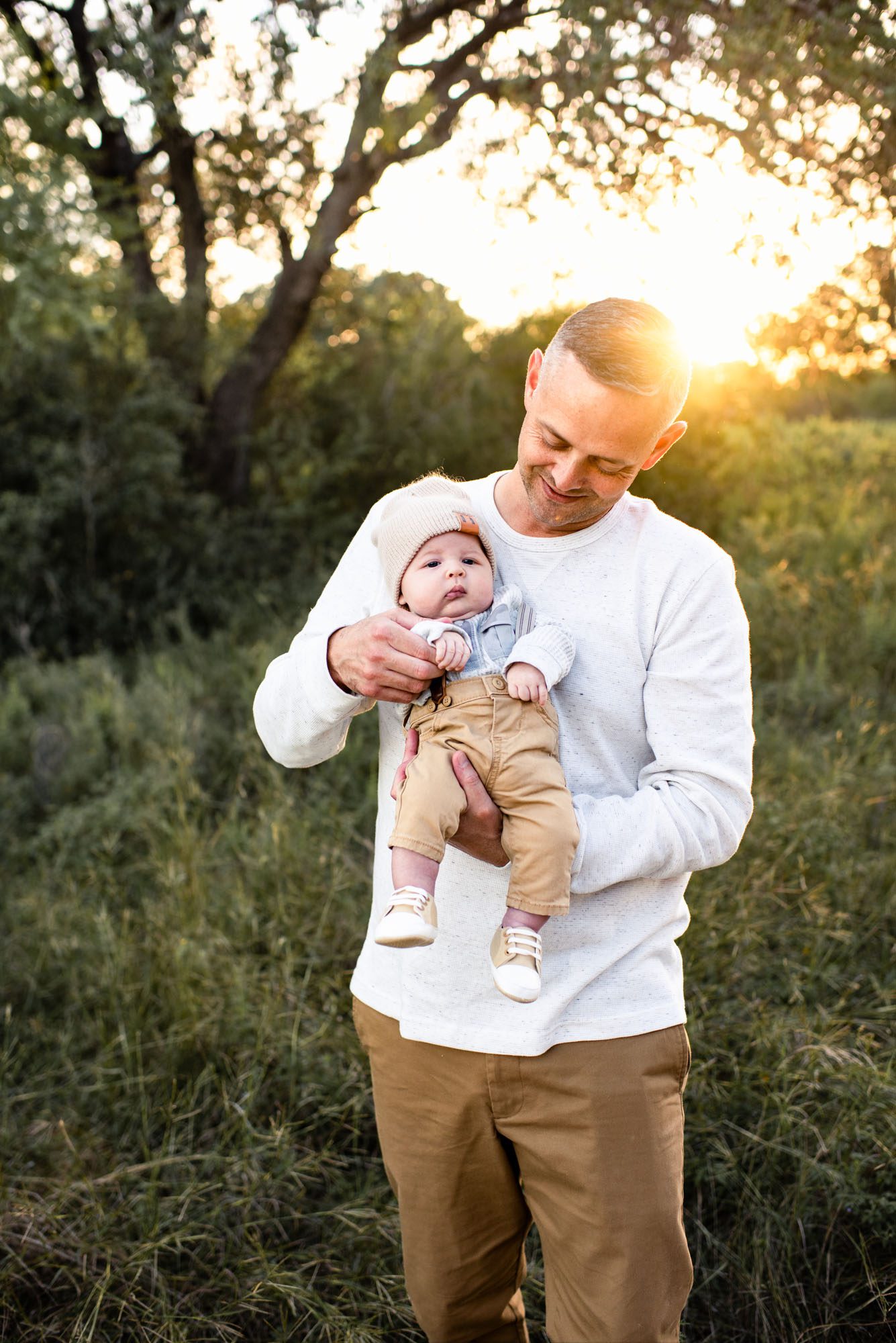 Father holding newborn baby boy, San Antonio Family Photographer