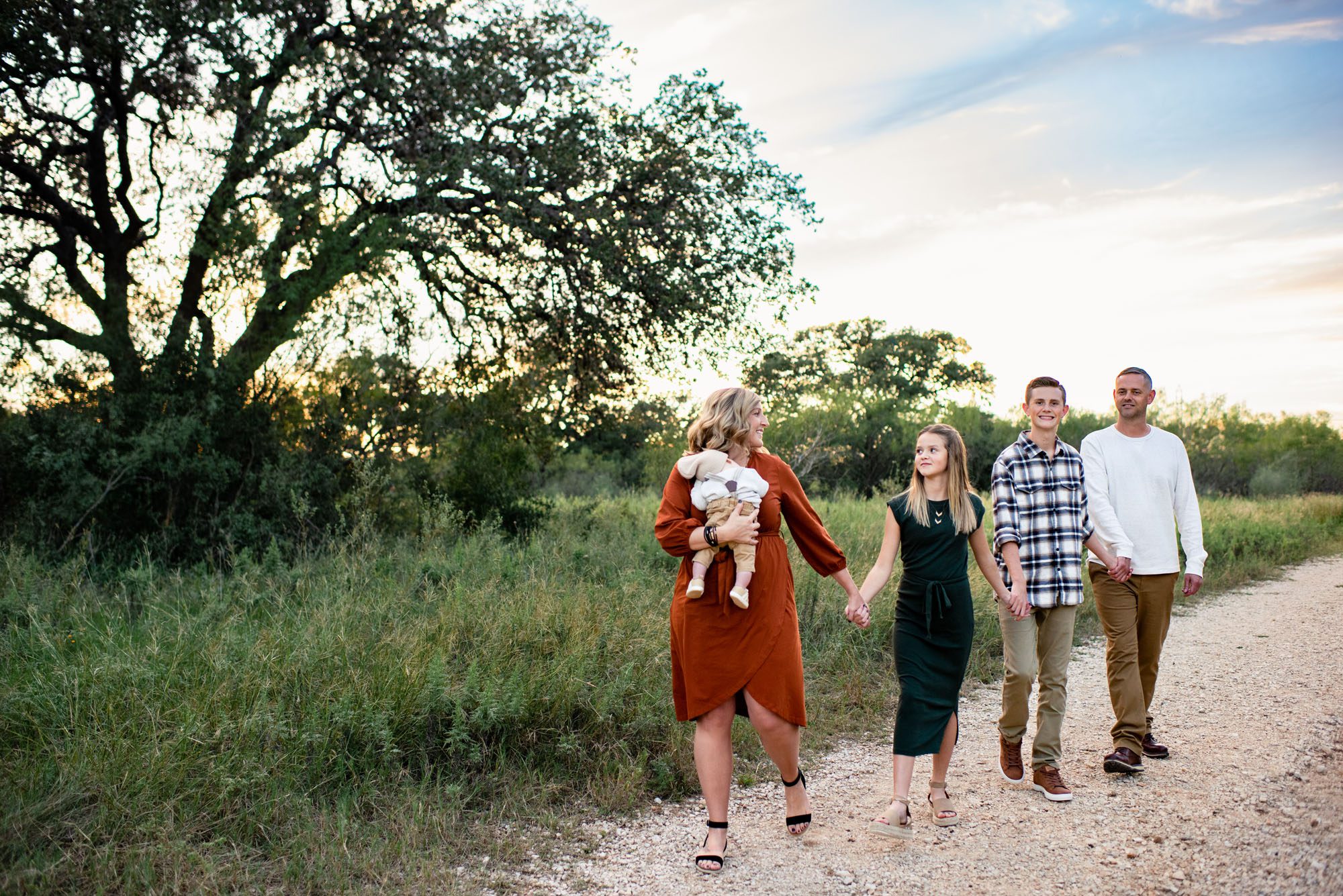 Family holding hands and walking , San Antonio Lifestyle Photographer
