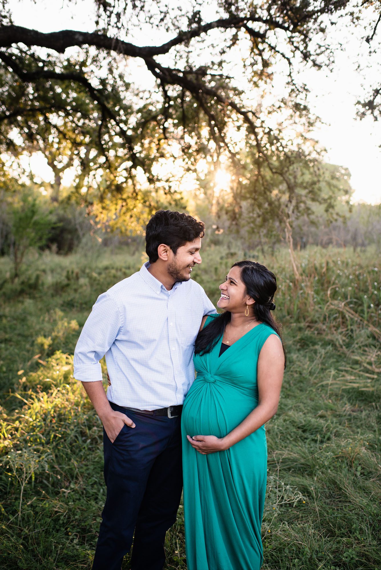 Pregnant couple laughing and smiling together, San Antonio Lifestyle Maternity Photography