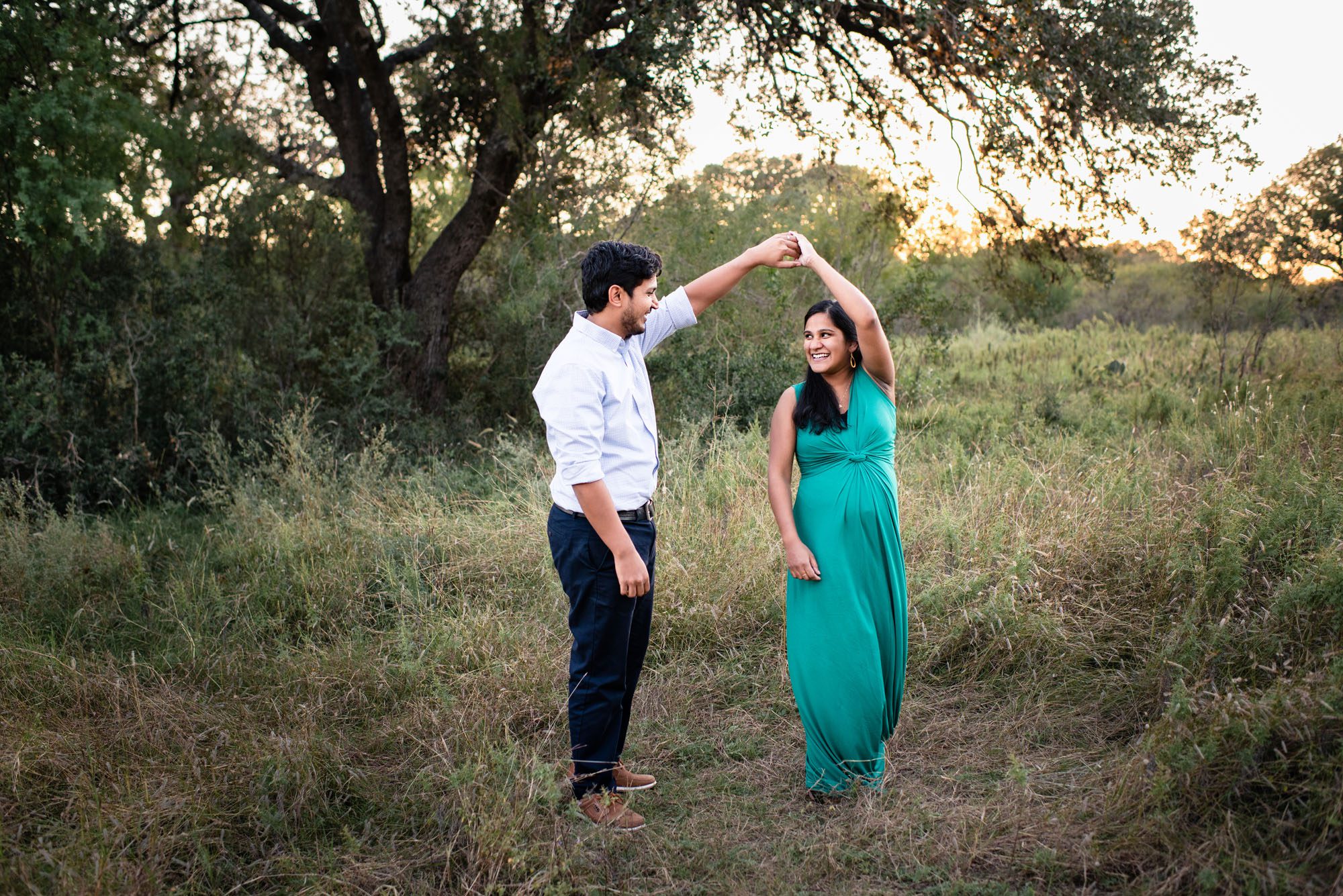 Couple dancing in a field, Best San Antonio Maternity Photographer